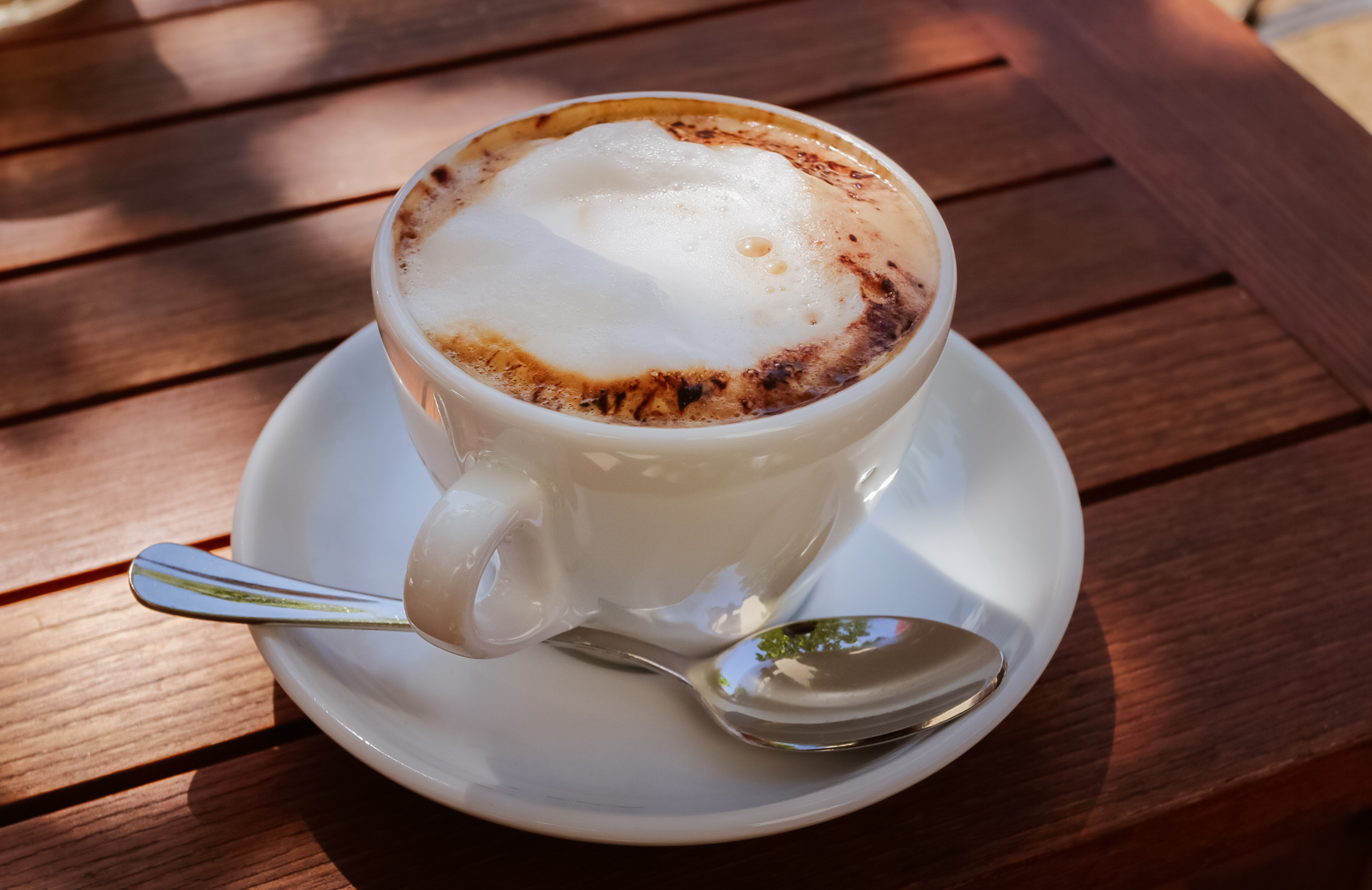 cappuccino on wooden table