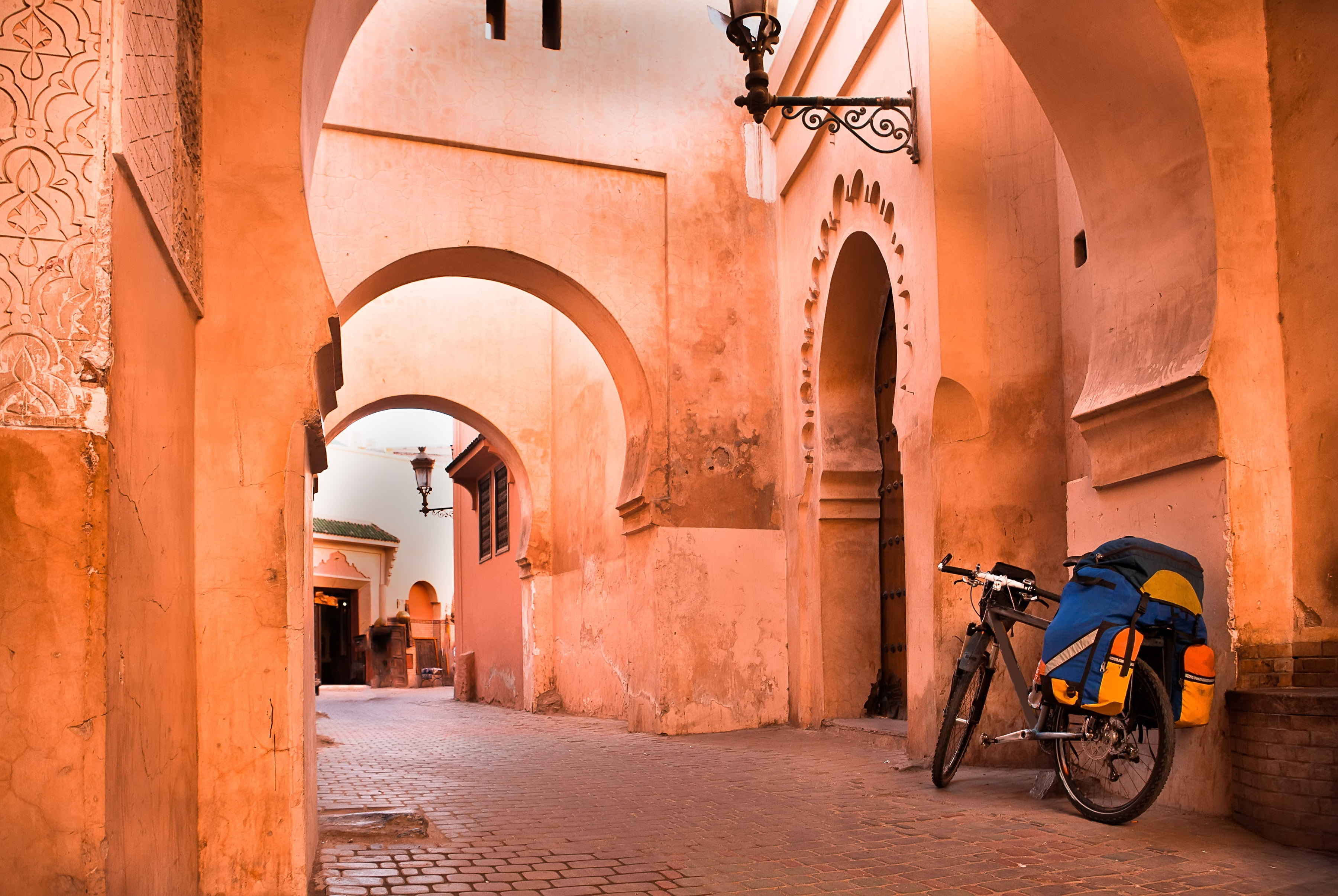 mountain bike standing near a red wall in the Muslim city of Marrakech