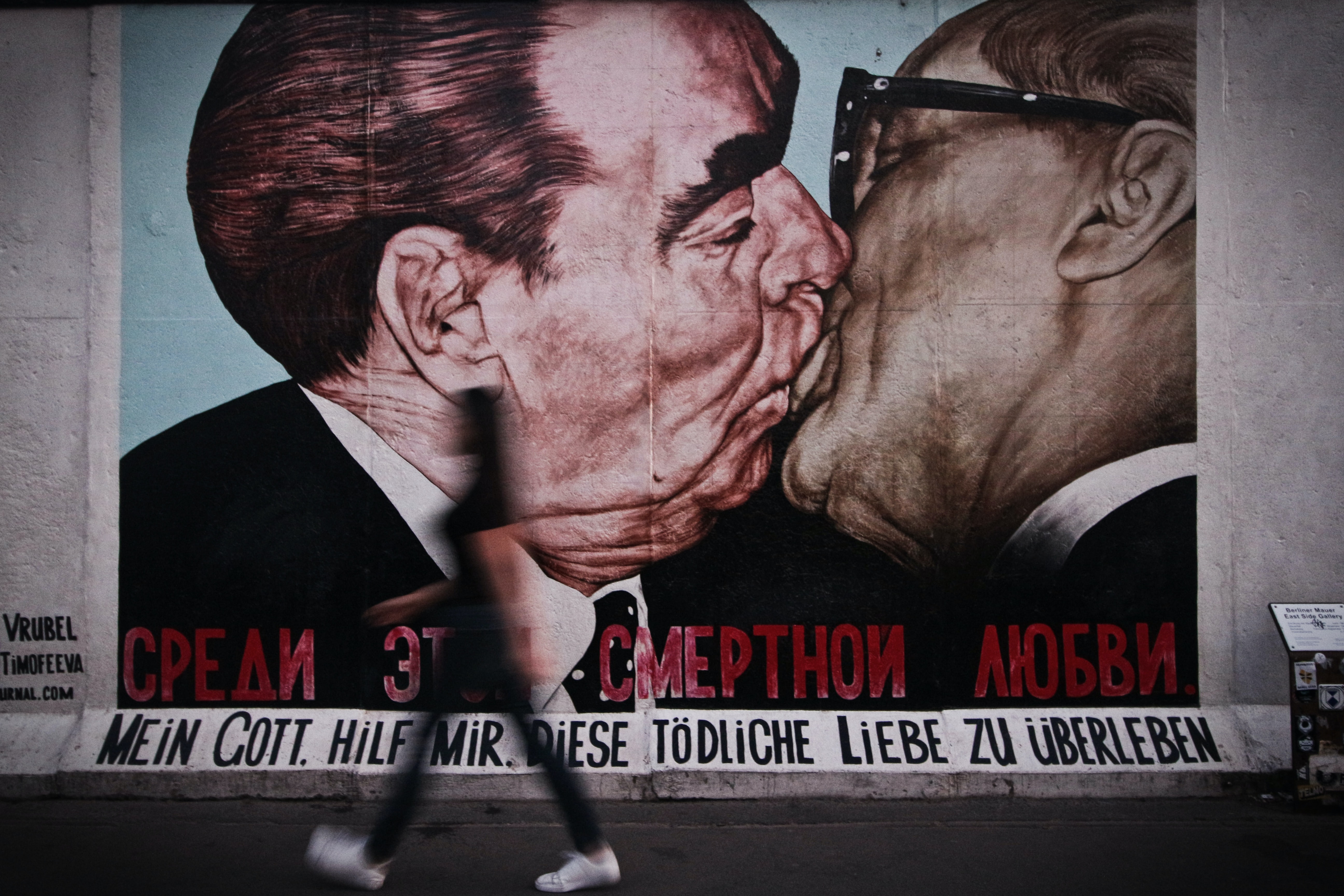 the most famous mural of Honecker and Breschnew in the East Side Gallery, Berlin, Germany