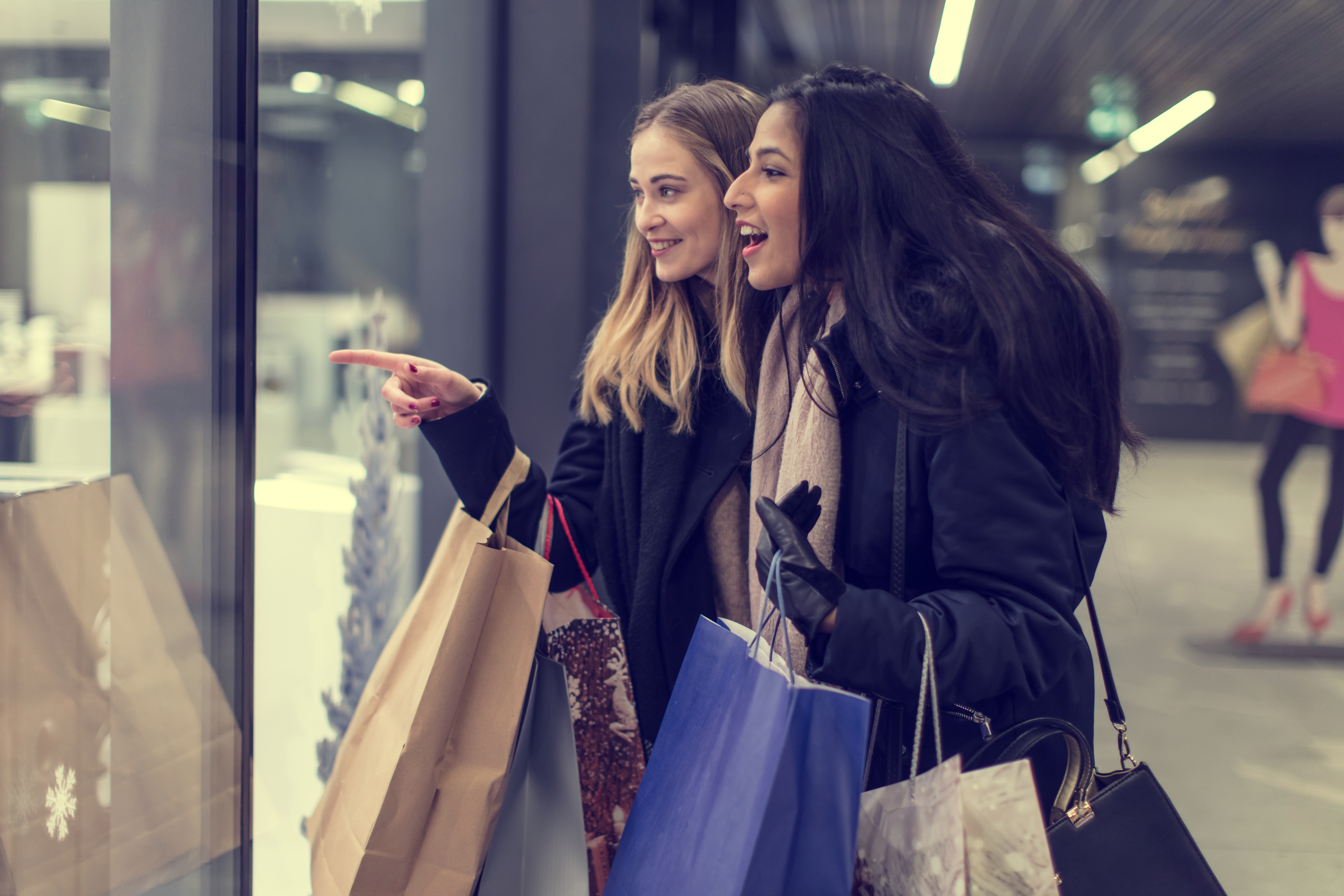 Two women in a shopping centre