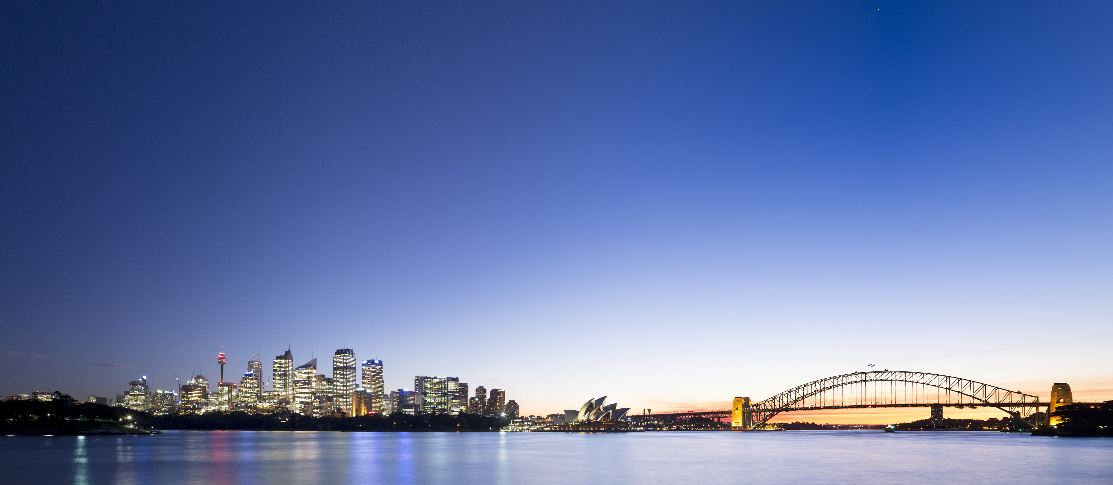 Panoramic view of Sydney Harbour at night