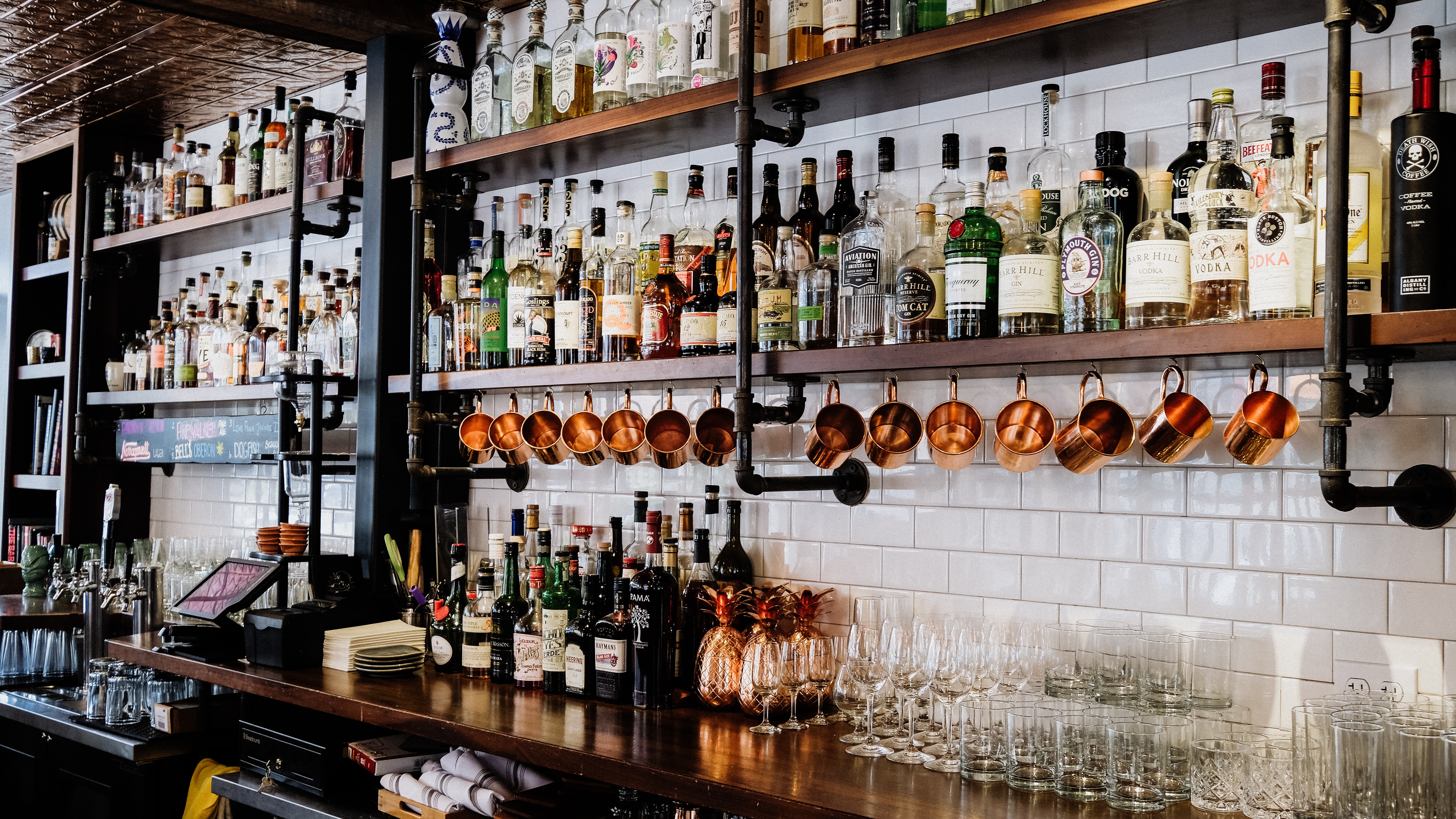 bar with liquor bottles, Schwarzes Cafe, Berlin, Germany