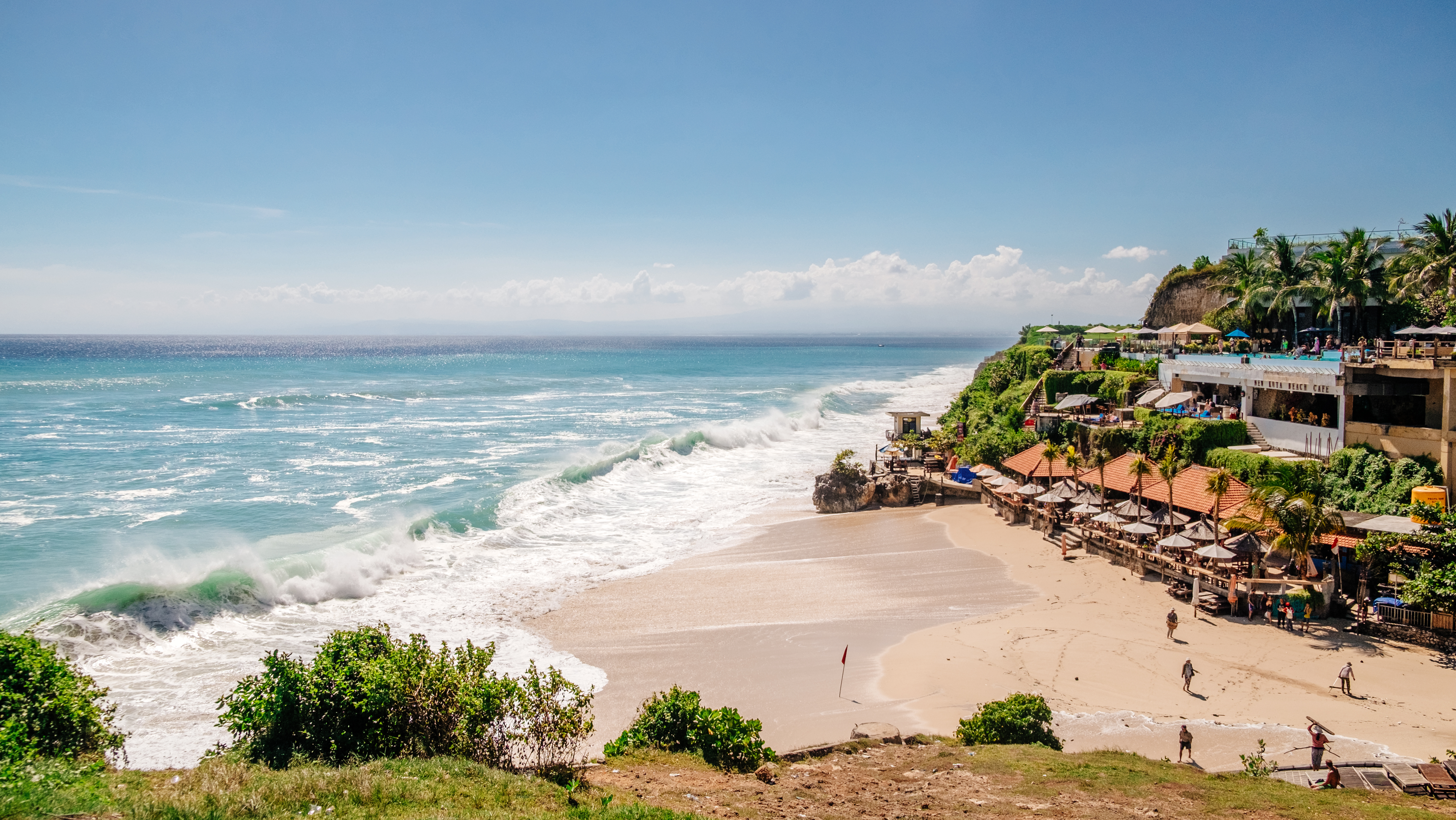 Bali seascape with huge waves at beautiful hidden white sand beach. Bali sea beach nature, outdoor Indonesia. Bali island landscape. Summer holidays at ocean beach. Travel vacation in Indonesia beach