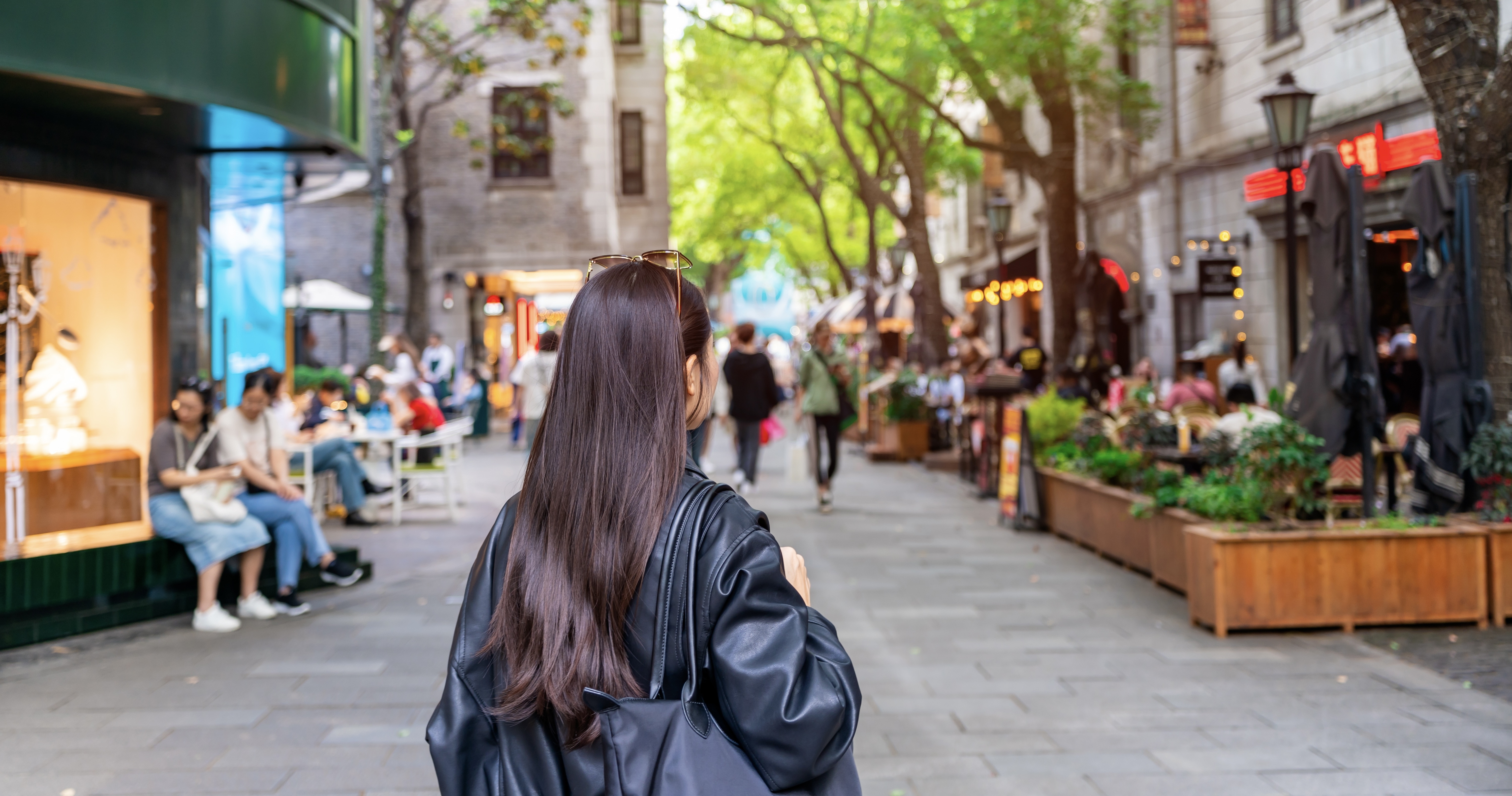 Young woman tourist walking at Xintiandi shopping street