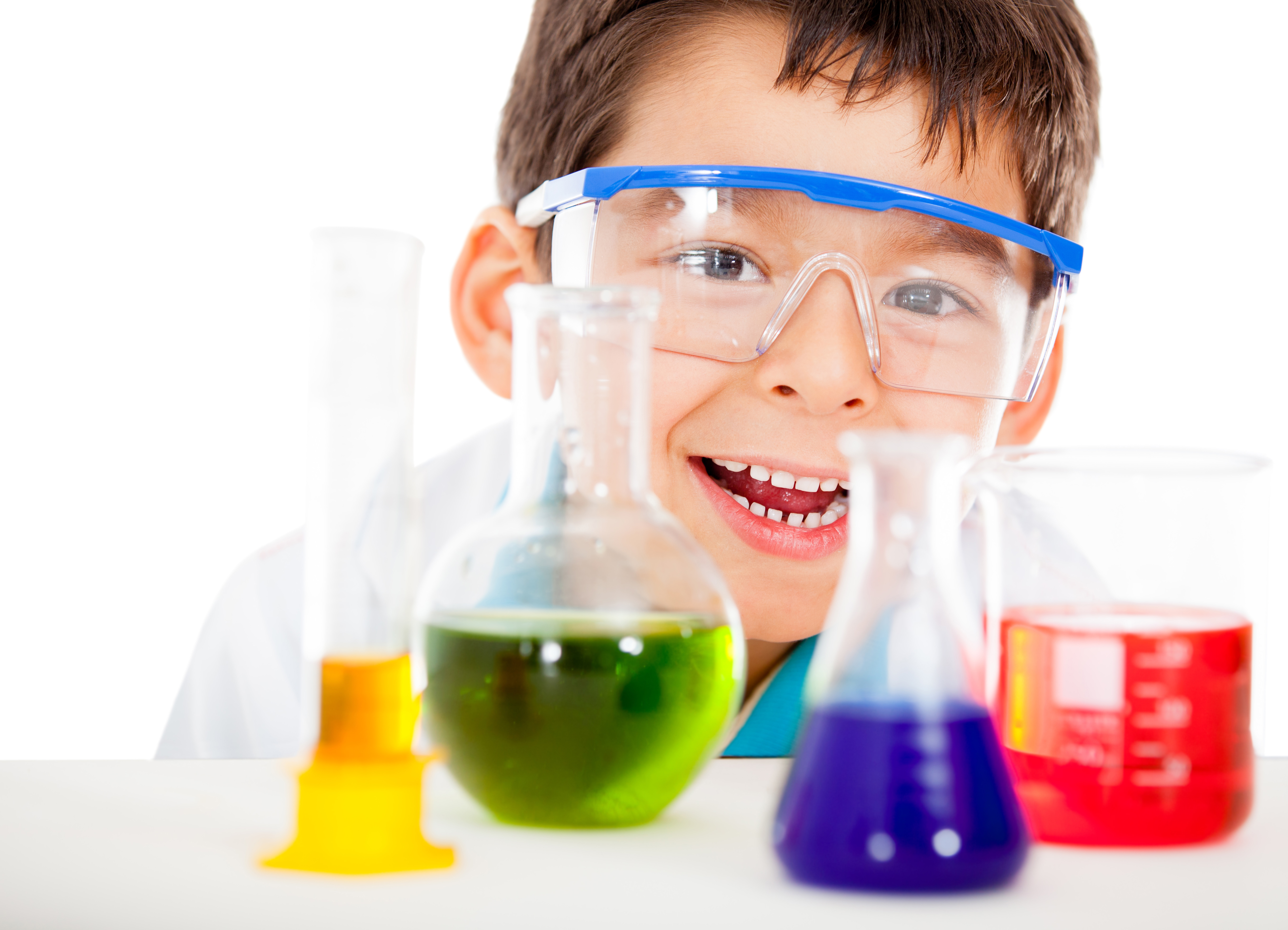 Happy little scientist playing at the lab - isolated over a white background
