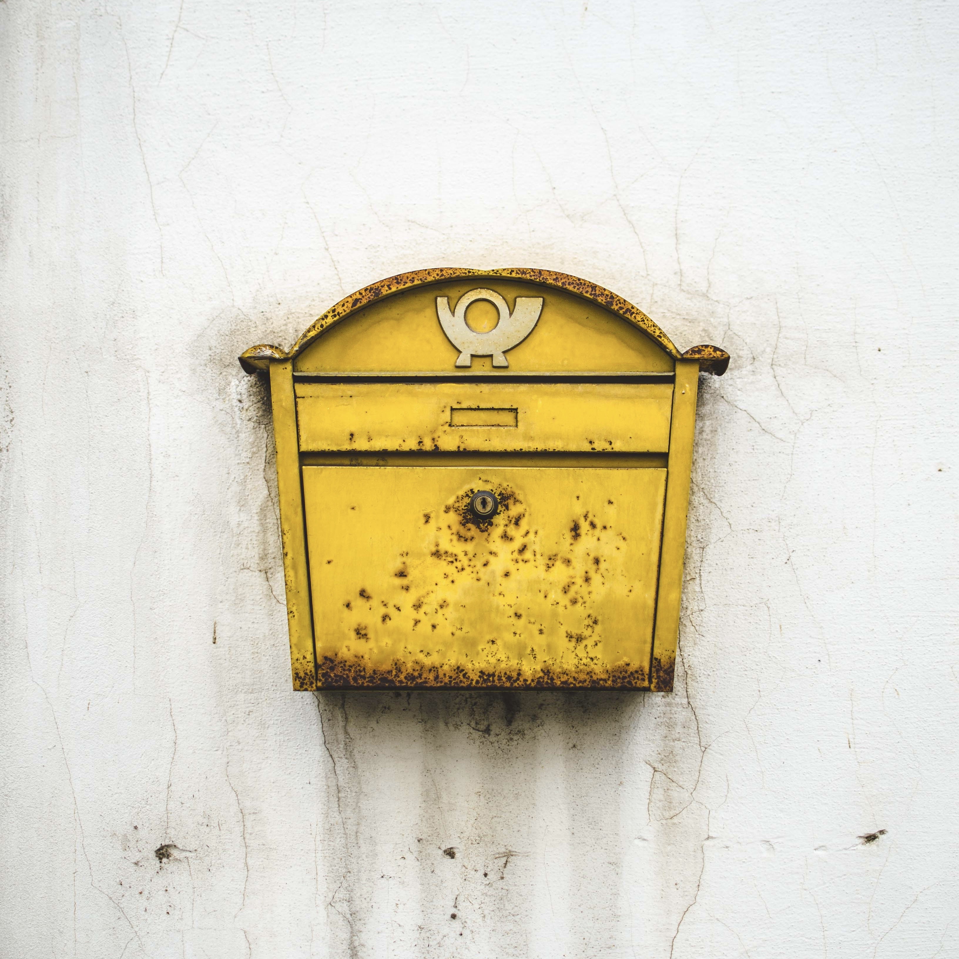A rusty yellow post box in Vienna