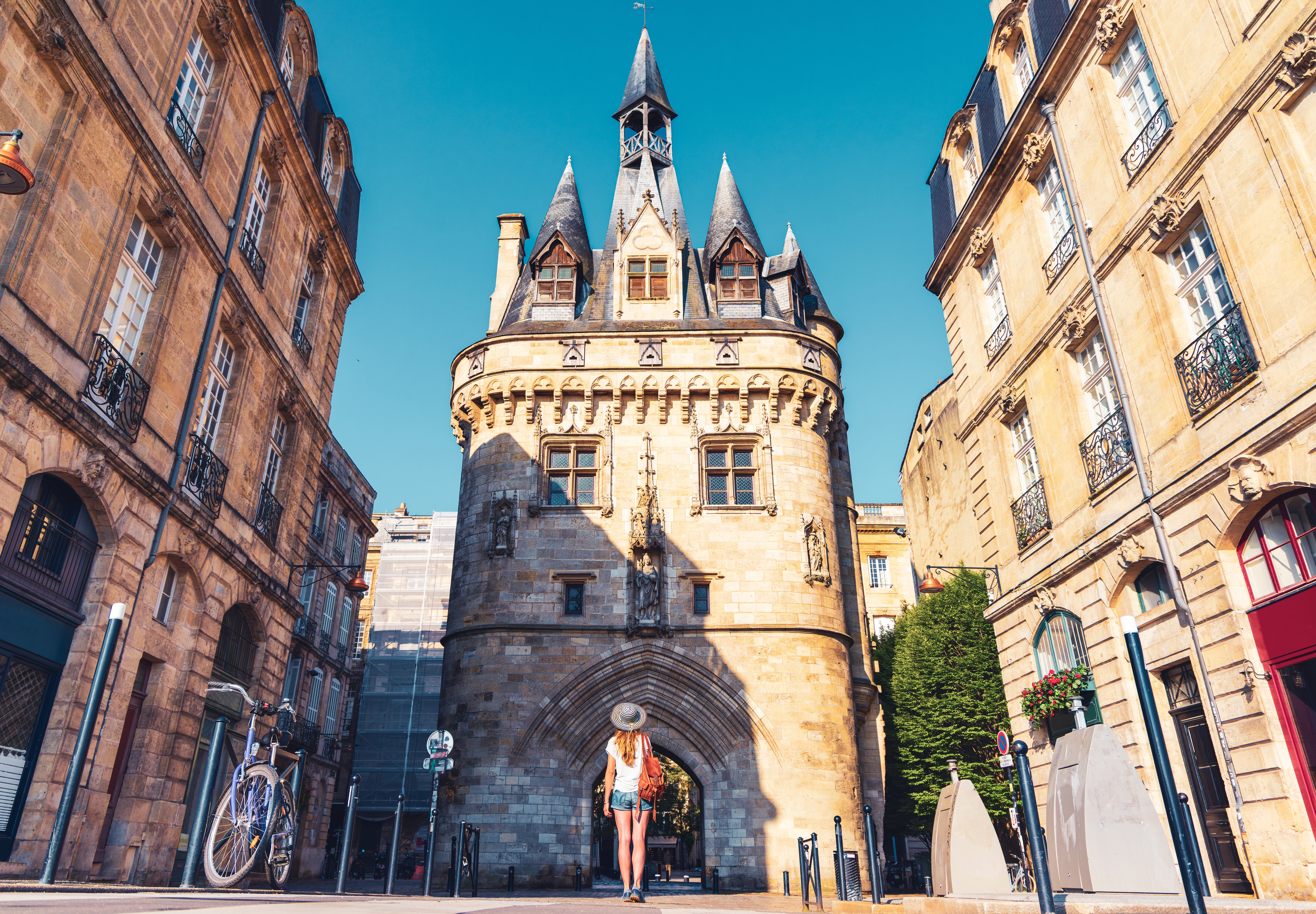Bordeaux city,  Porte Cailhau and woman tourist,  tourism in France, Nouvelle aquitaine