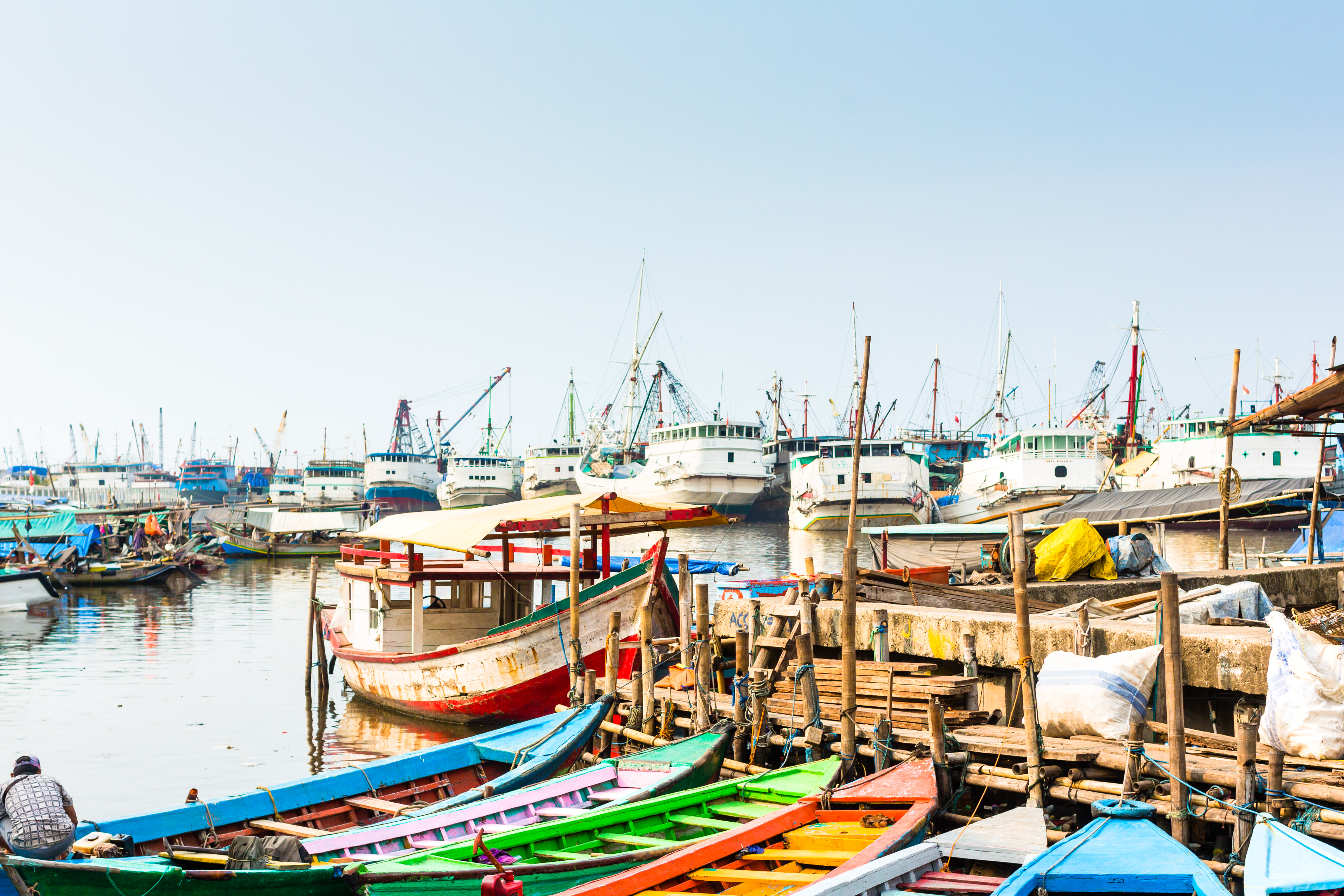 Sunda Kelapa old Harbour with fishing boats, ship and docks in Jakarta, Indonesia