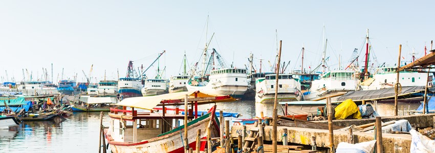 Sunda Kelapa old Harbour with fishing boats, ship and docks in Jakarta, Indonesia