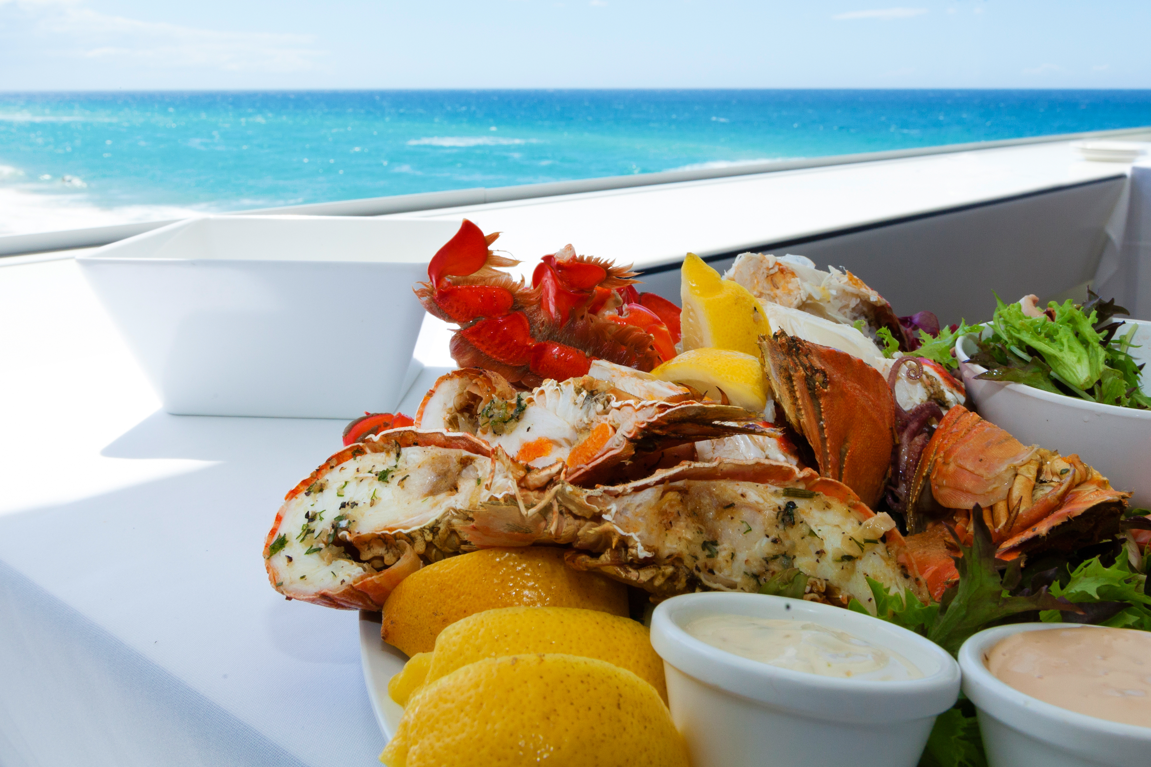 Mixed seafood plate by a tropical beach