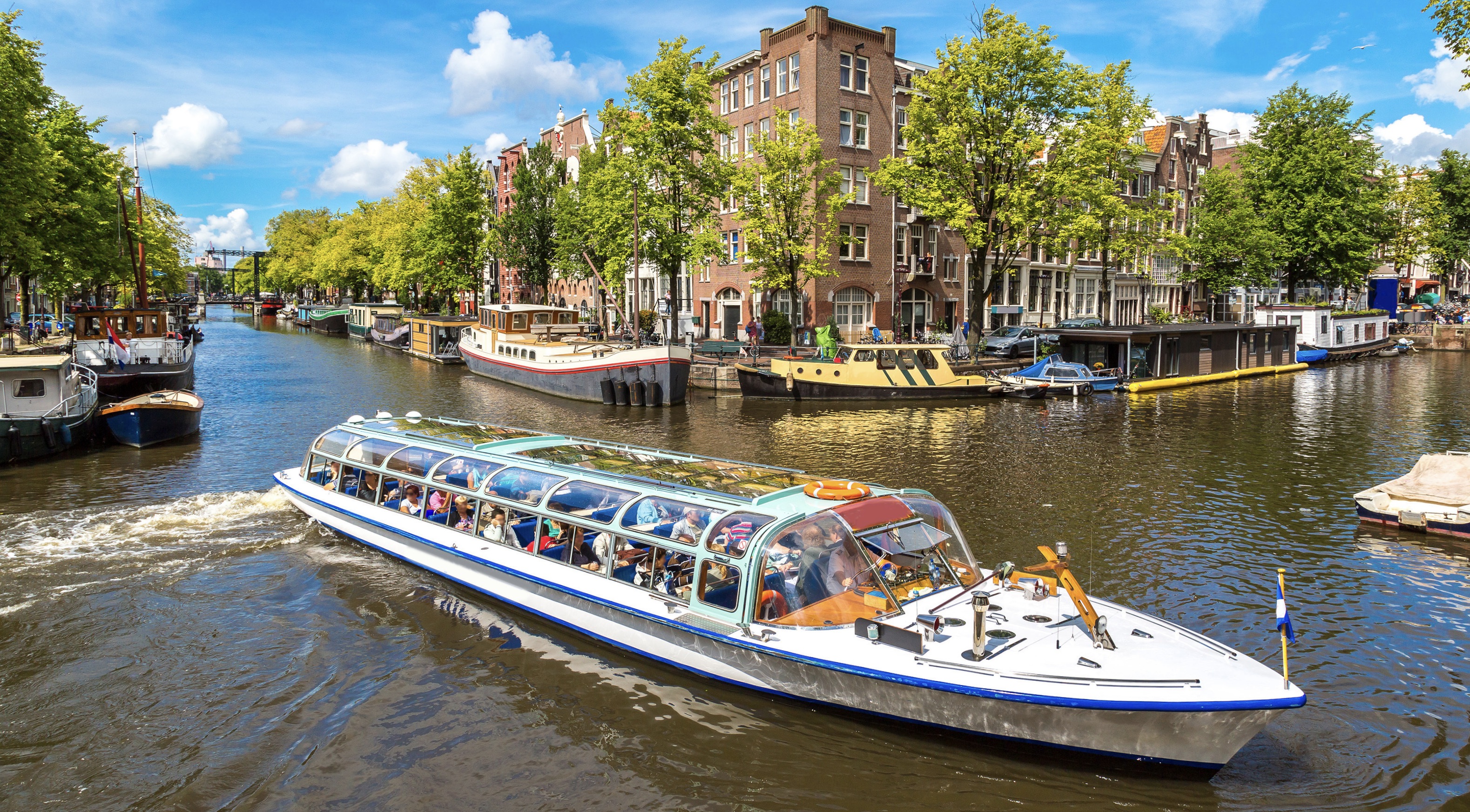 tourist boat going through the canals of Amsterdam