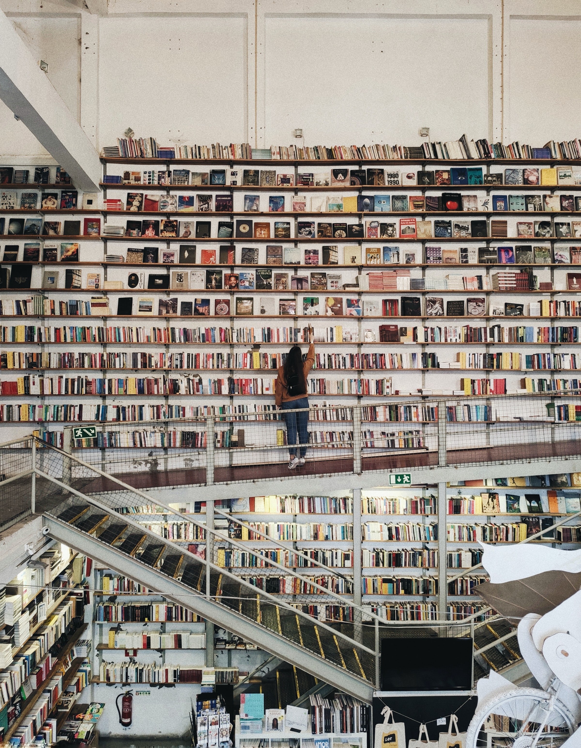 the many bookshelves of Ler Devagar shop and cafe in Lisbon