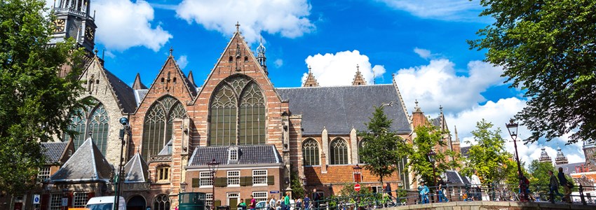 Oude Kerk (Old Church) and Voorburgwal canal in Amsterdam