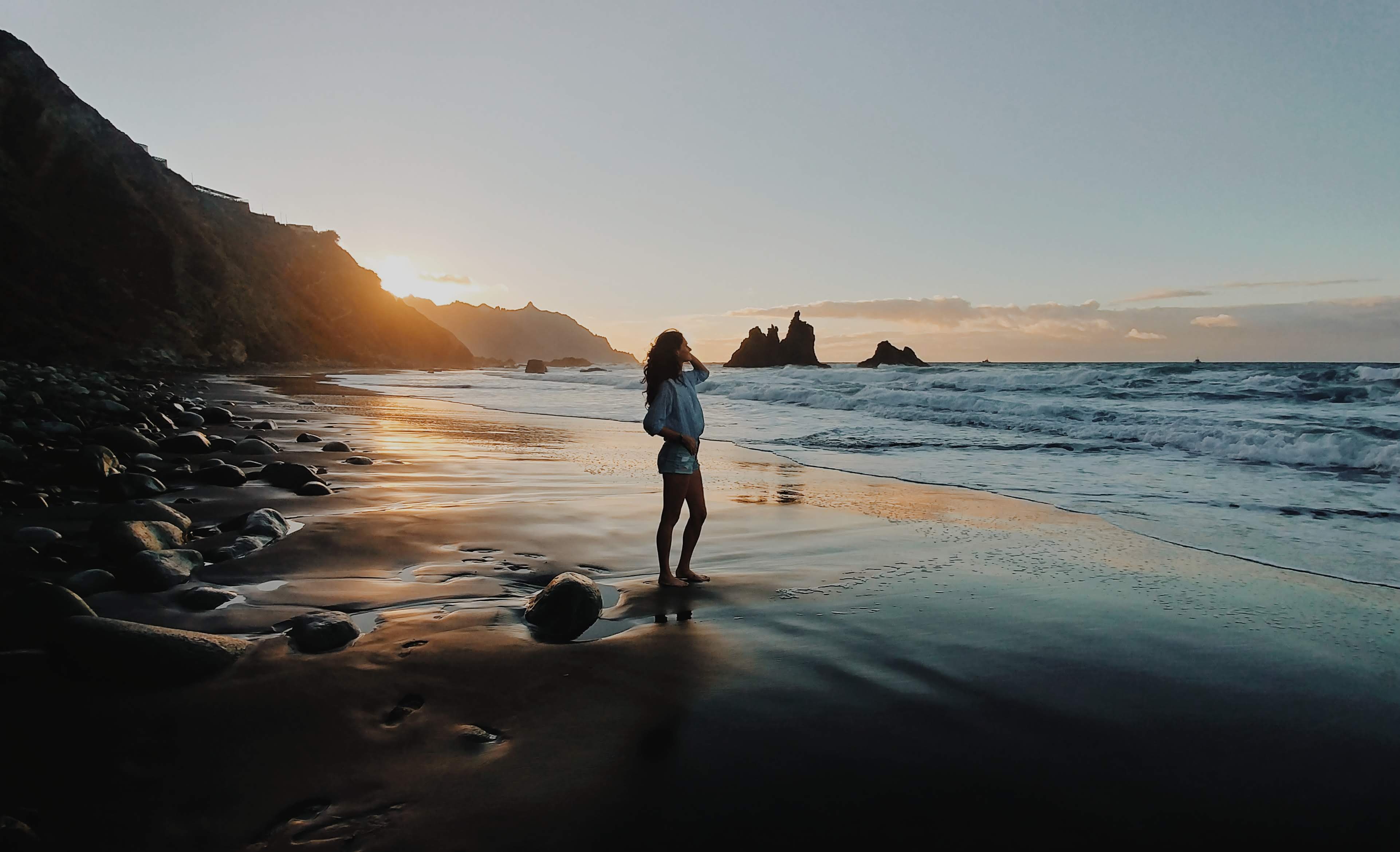 Woman on a Black Sand Beach