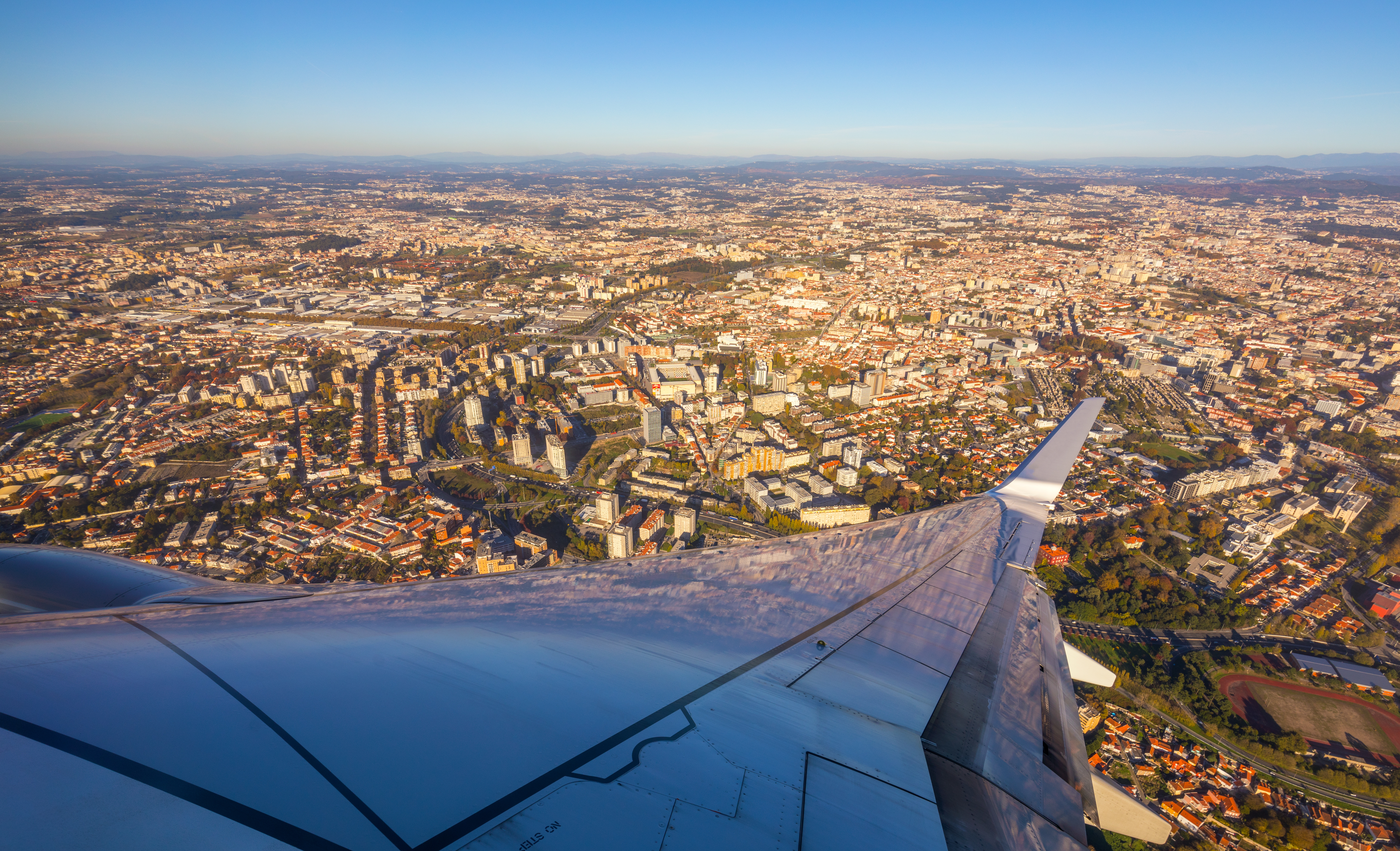 Top view of Porto and wing of airplane from window of airplane