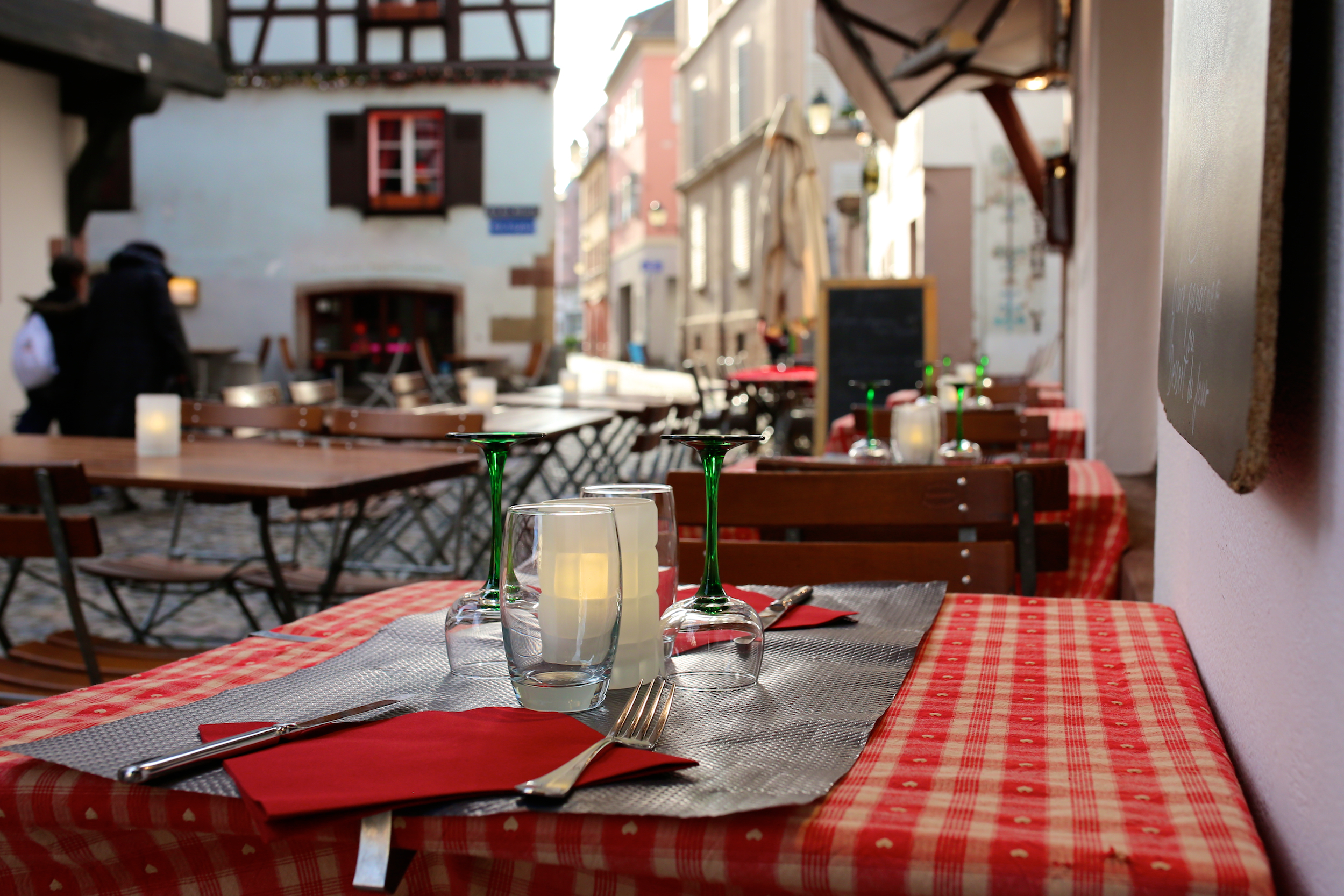 Open air street restaurant in the medieval Petite-France district, Strasbourg