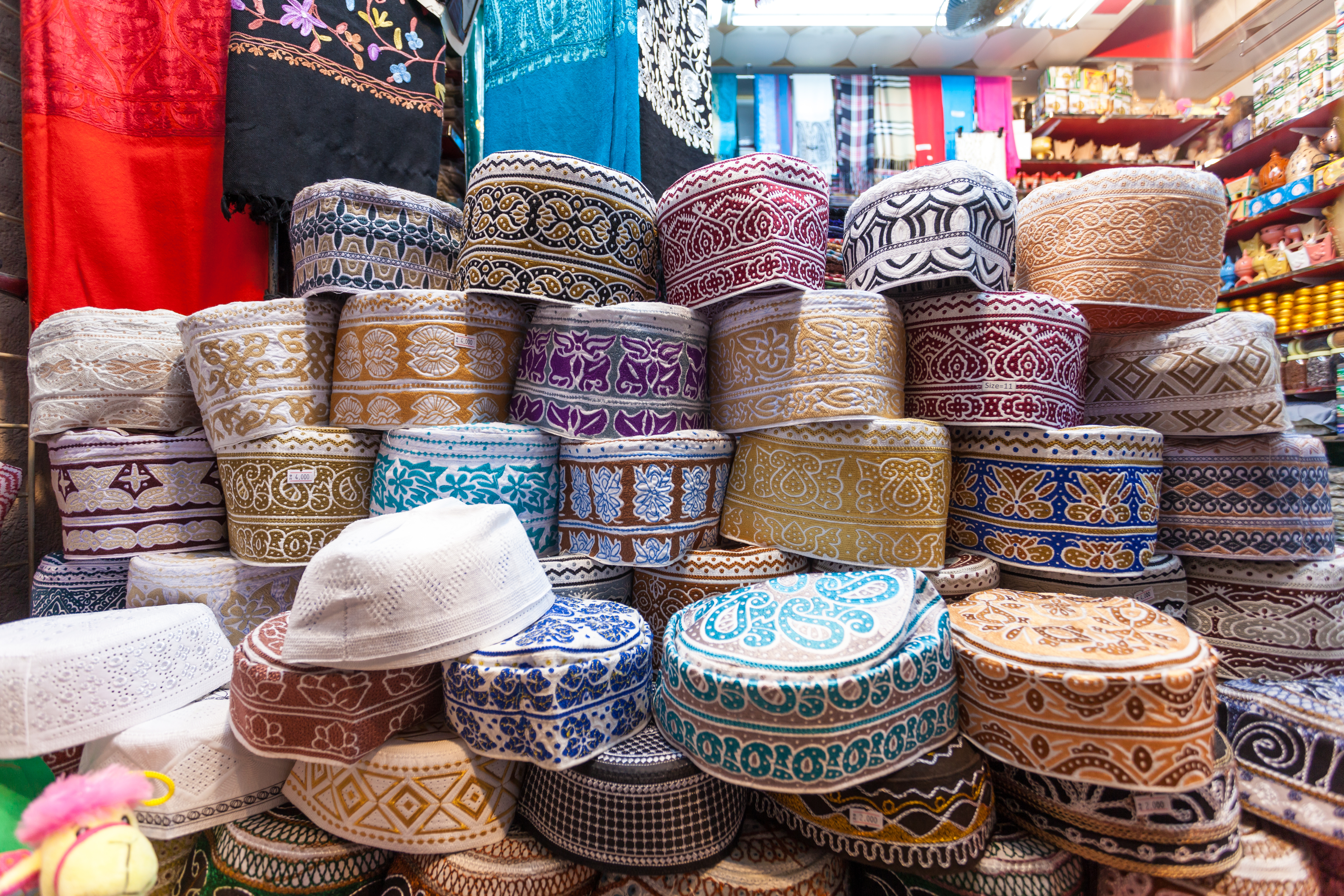 Traditional omani kuma hats for sale at the souq in Muscat