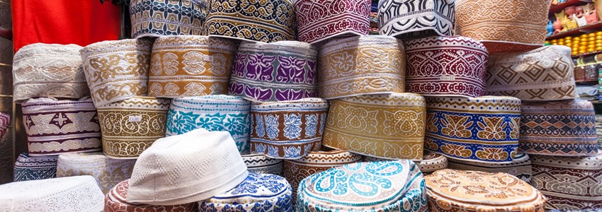 Traditional omani kuma hats for sale at the souq in Muscat