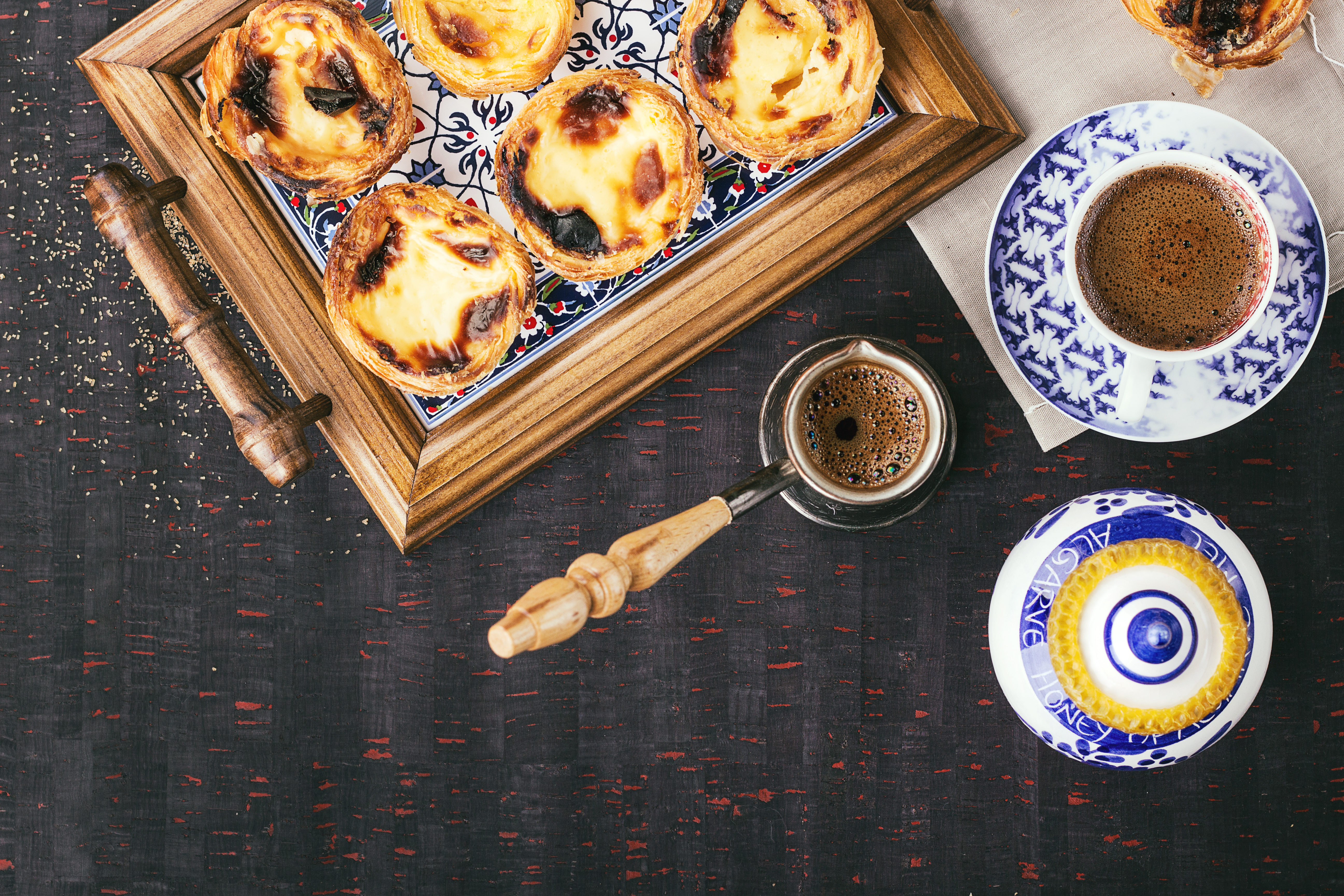 Pastel de Nata on plate with cafe