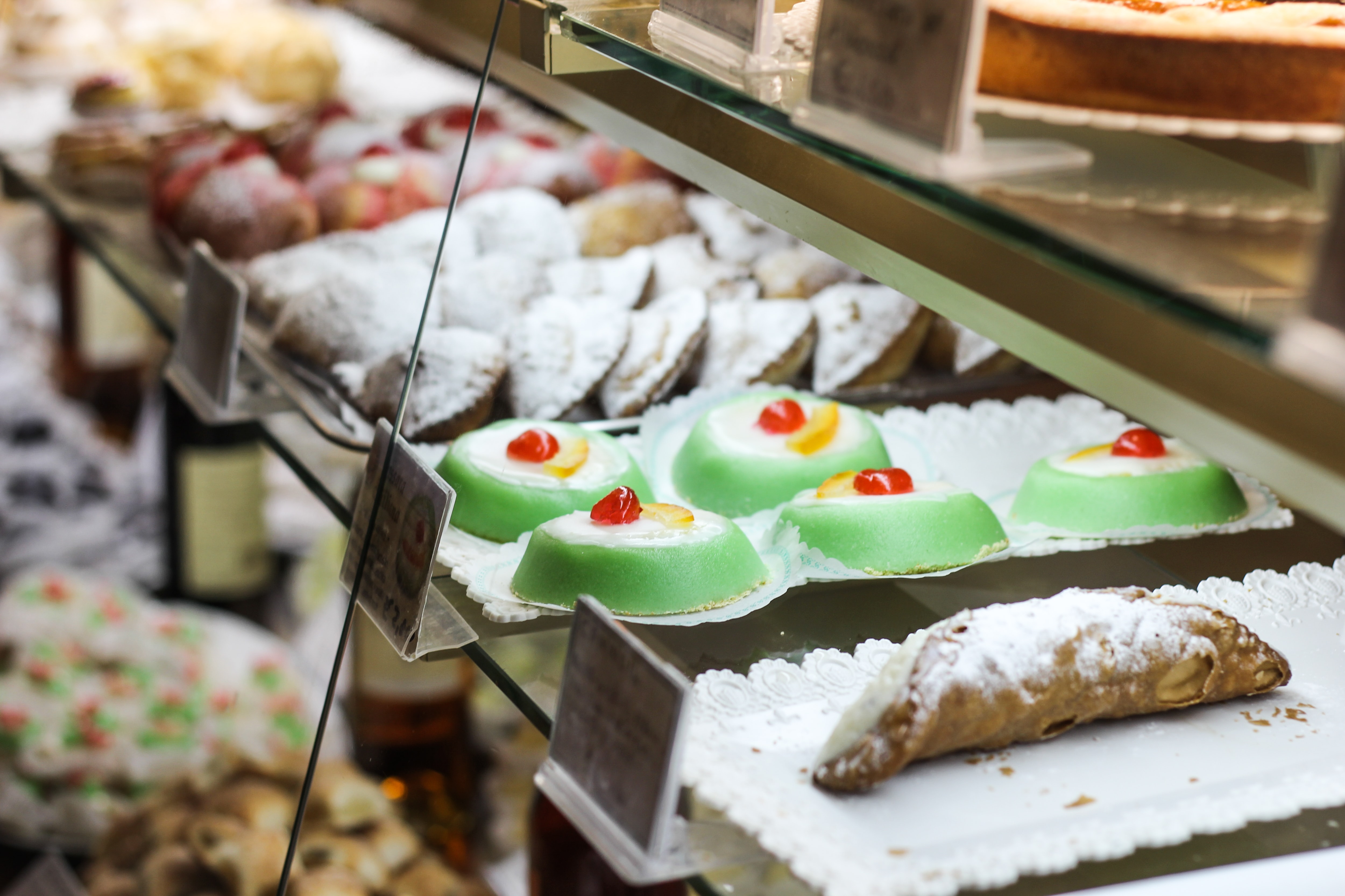 Typical italian dessert from south italy: cannolo, cassata, genovese in a pastry counter
