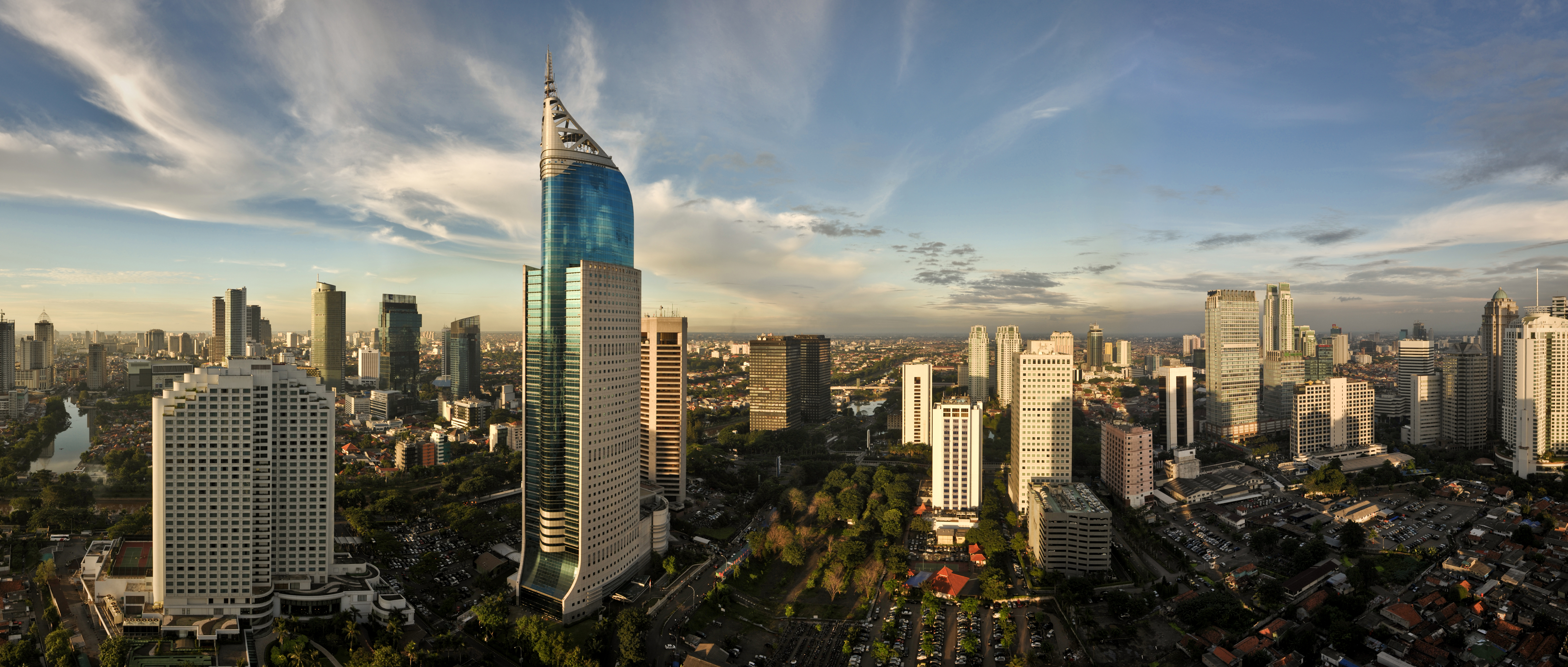 Panoramic cityscape of Indonesia capital city Jakarta at sunset. A r