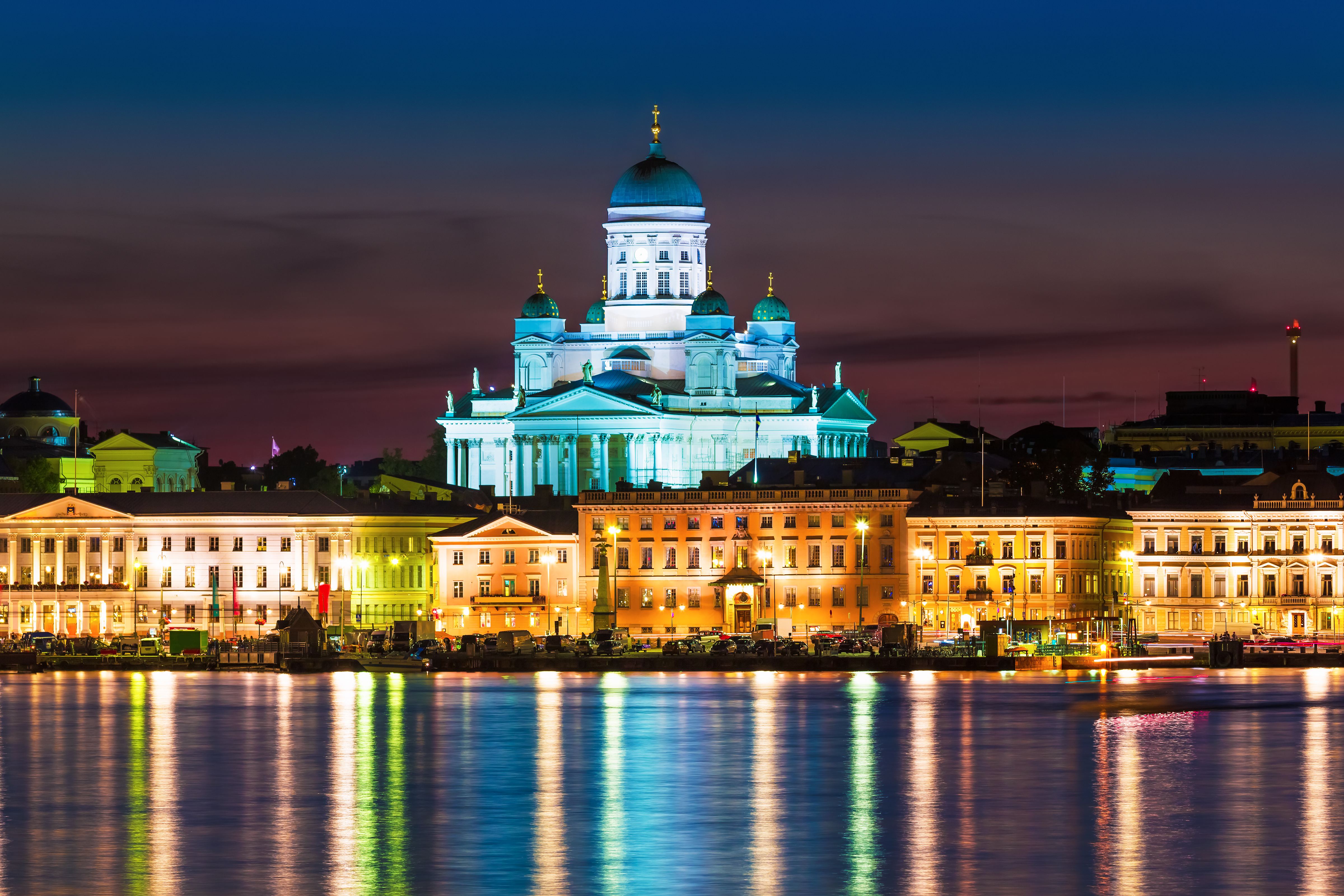 Scenic night view of the Old Town architecture and pier with Market Square and Lutheran Christian Cathedral Church at the Senate Square in Helsinki, Finland