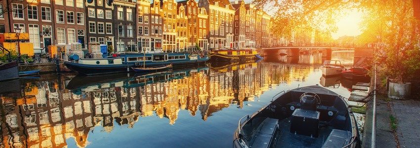 Amsterdam canal at sunset. Amsterdam is the capital and most populous city in Netherlands.