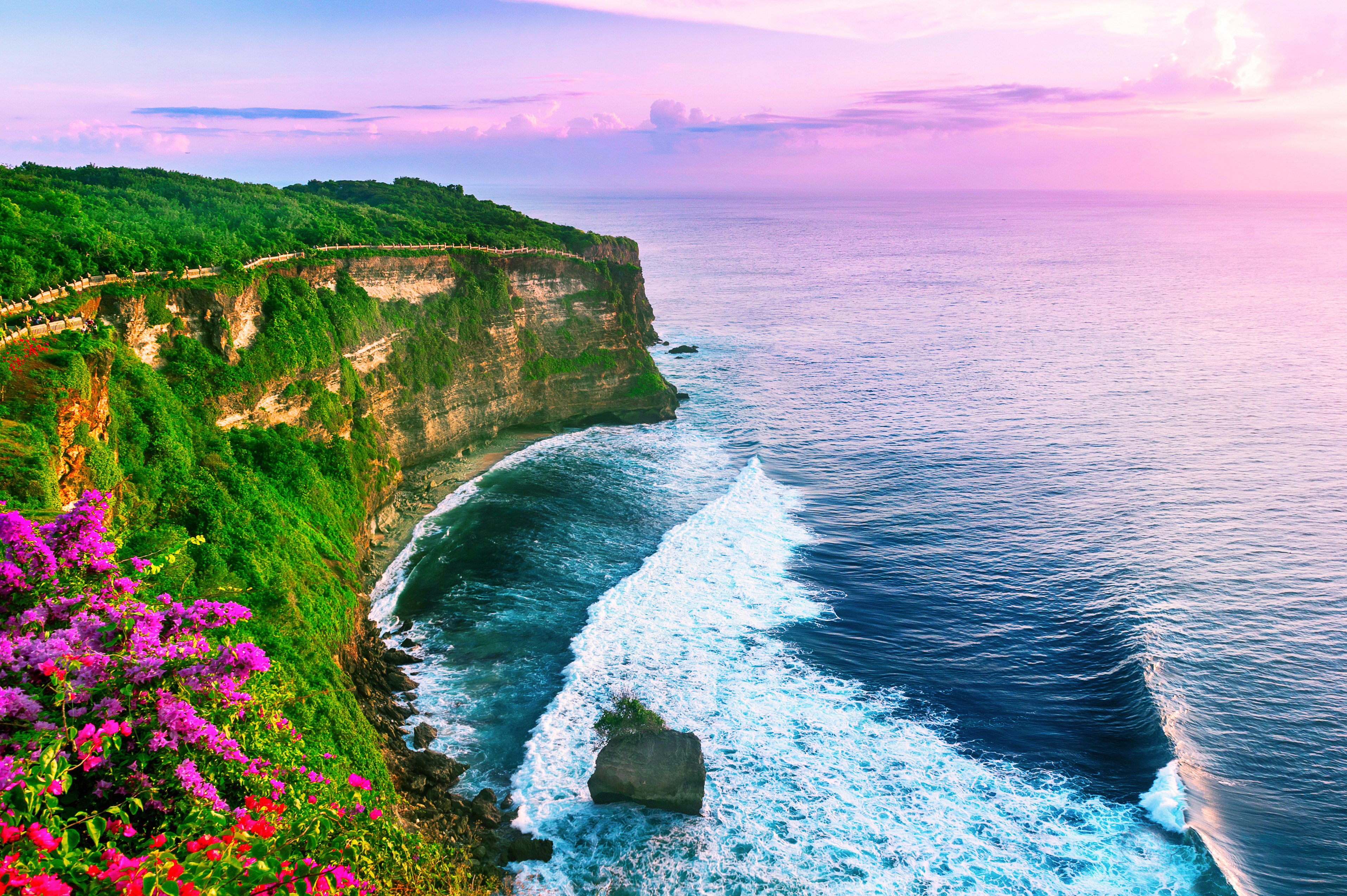 View of Uluwatu cliff with pavilion and blue sea in Bali, Indonesia