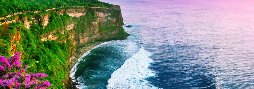 View of Uluwatu cliff with pavilion and blue sea in Bali, Indonesia