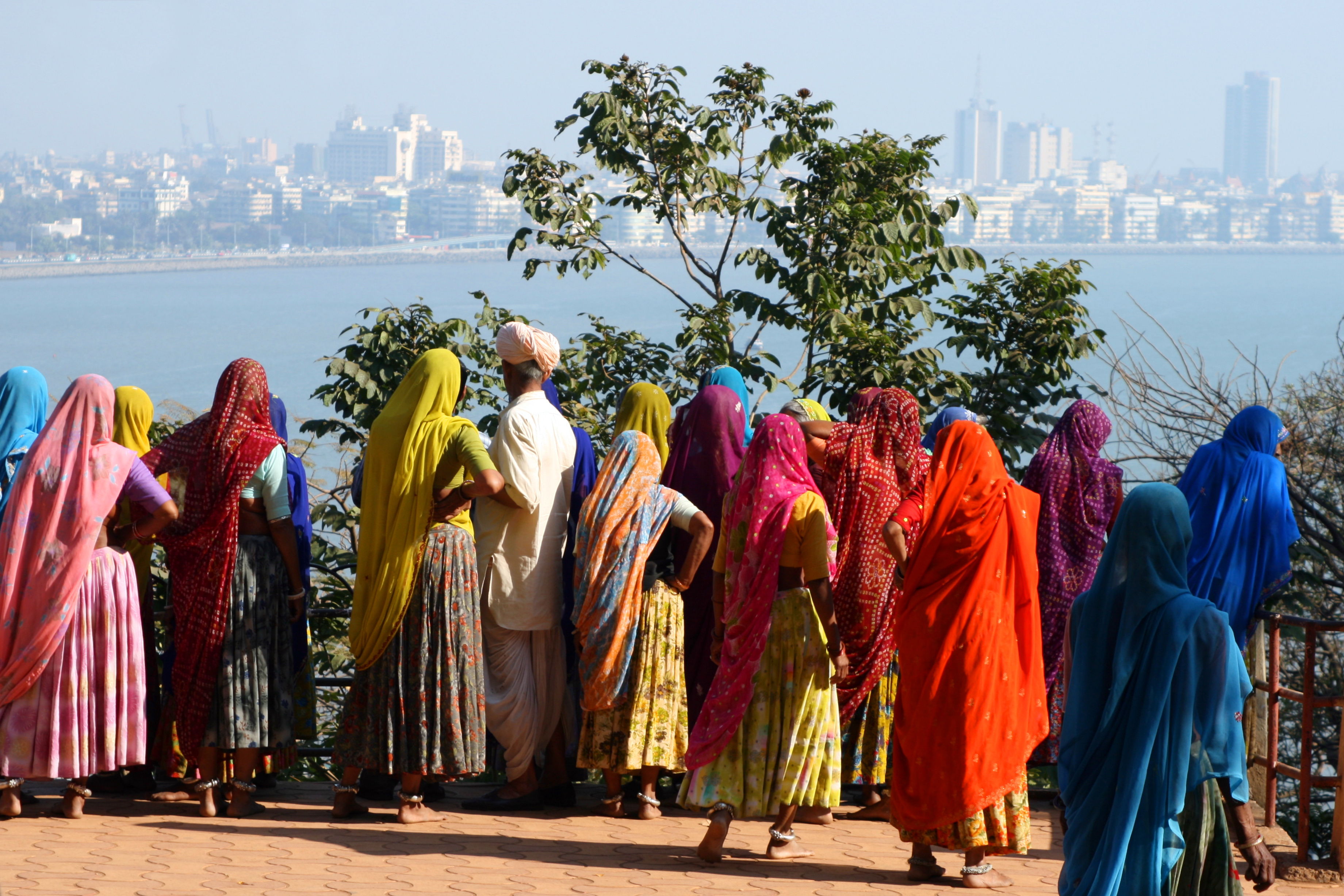 A group of indian women looking at the skyline of mumbai