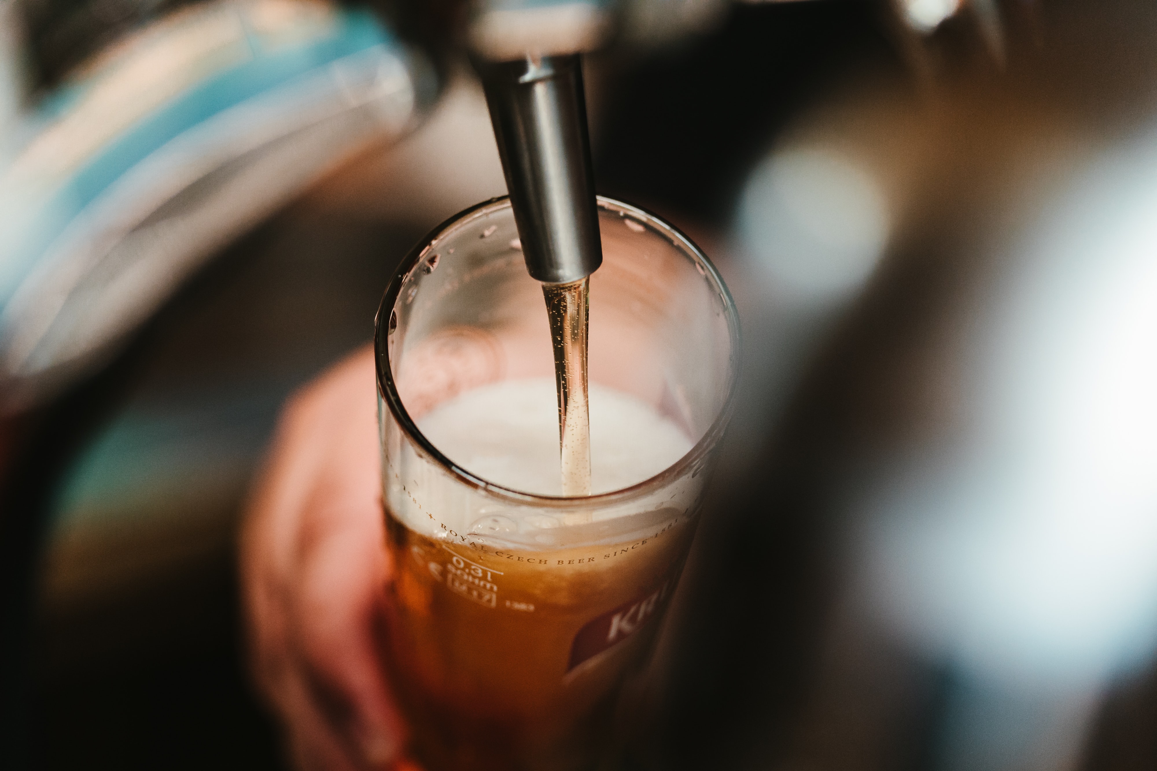 Bartender pouring a glass of beer