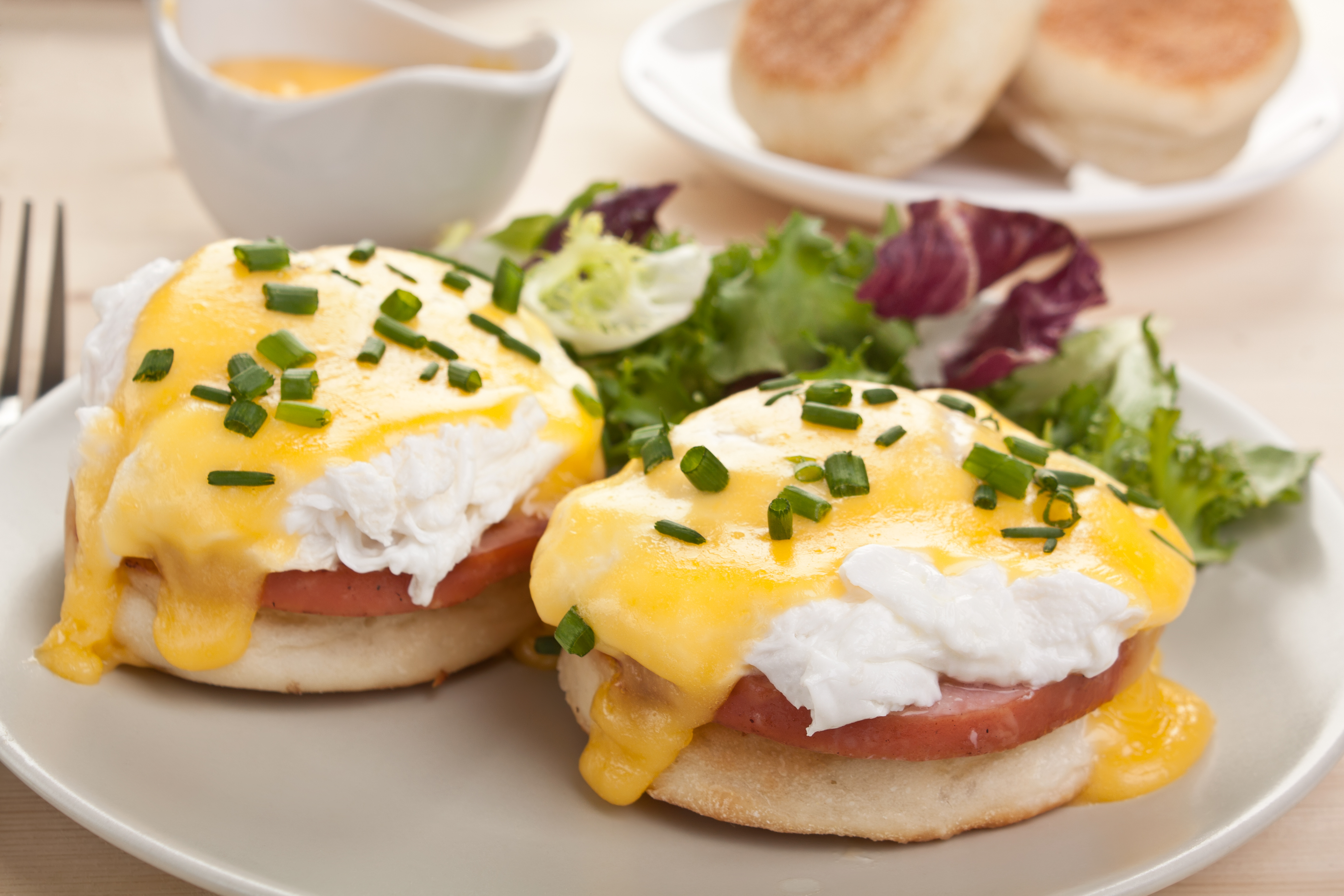 Eggs Benedict- toasted English muffins, ham, poached eggs, and delicious buttery hollandaise sauce