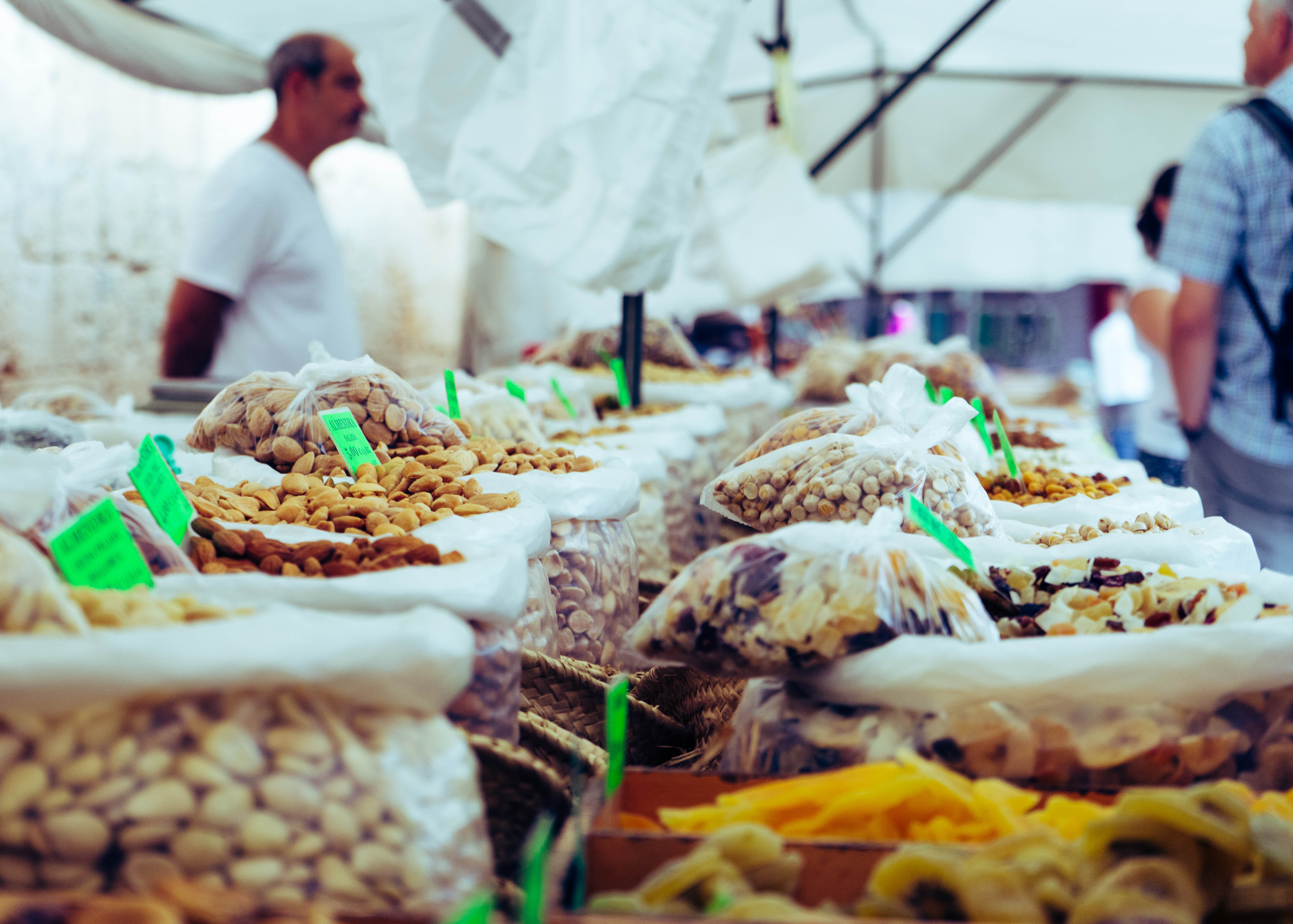 Market stall with various dried fruits and nuts