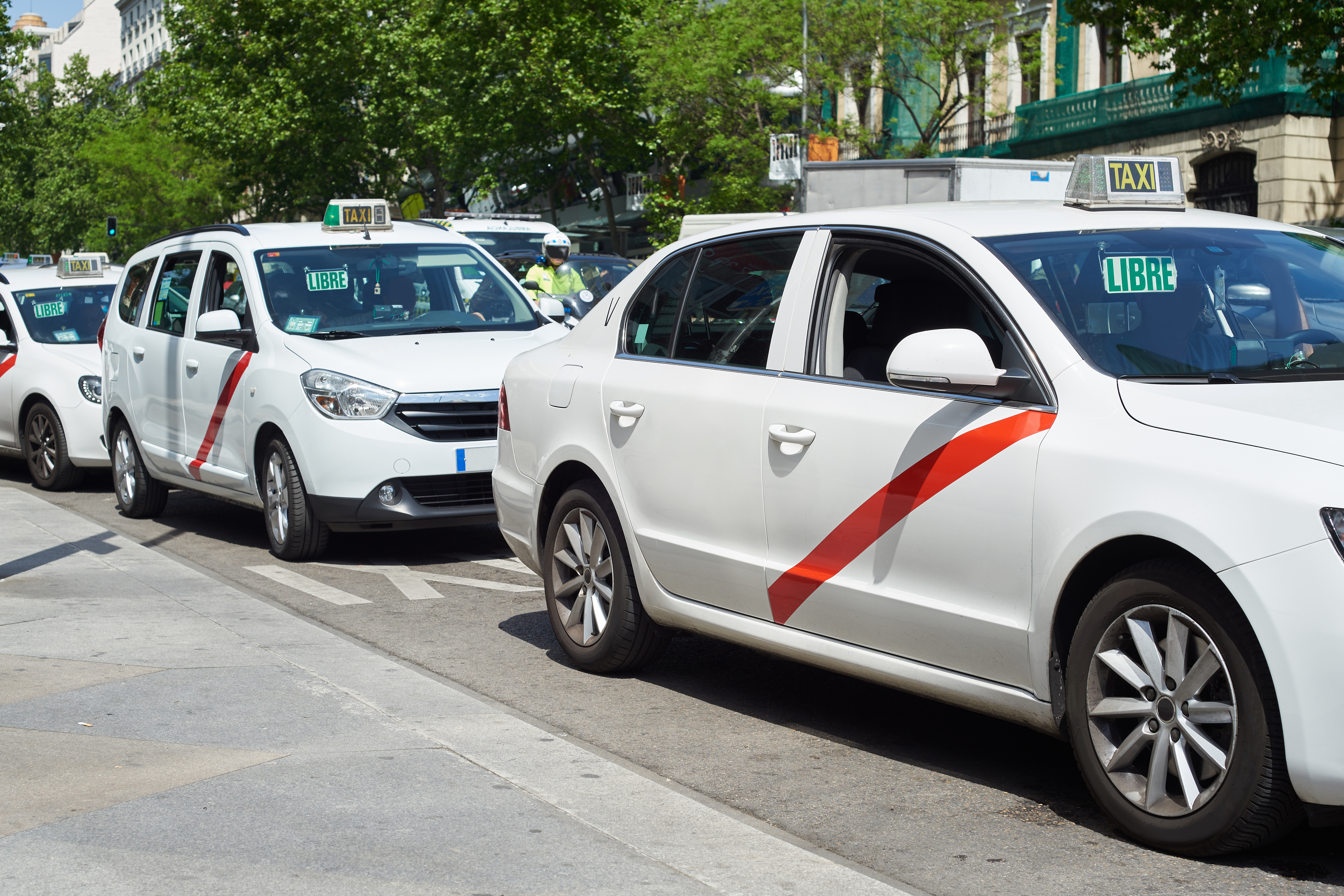 White taxi cars on Madrid street