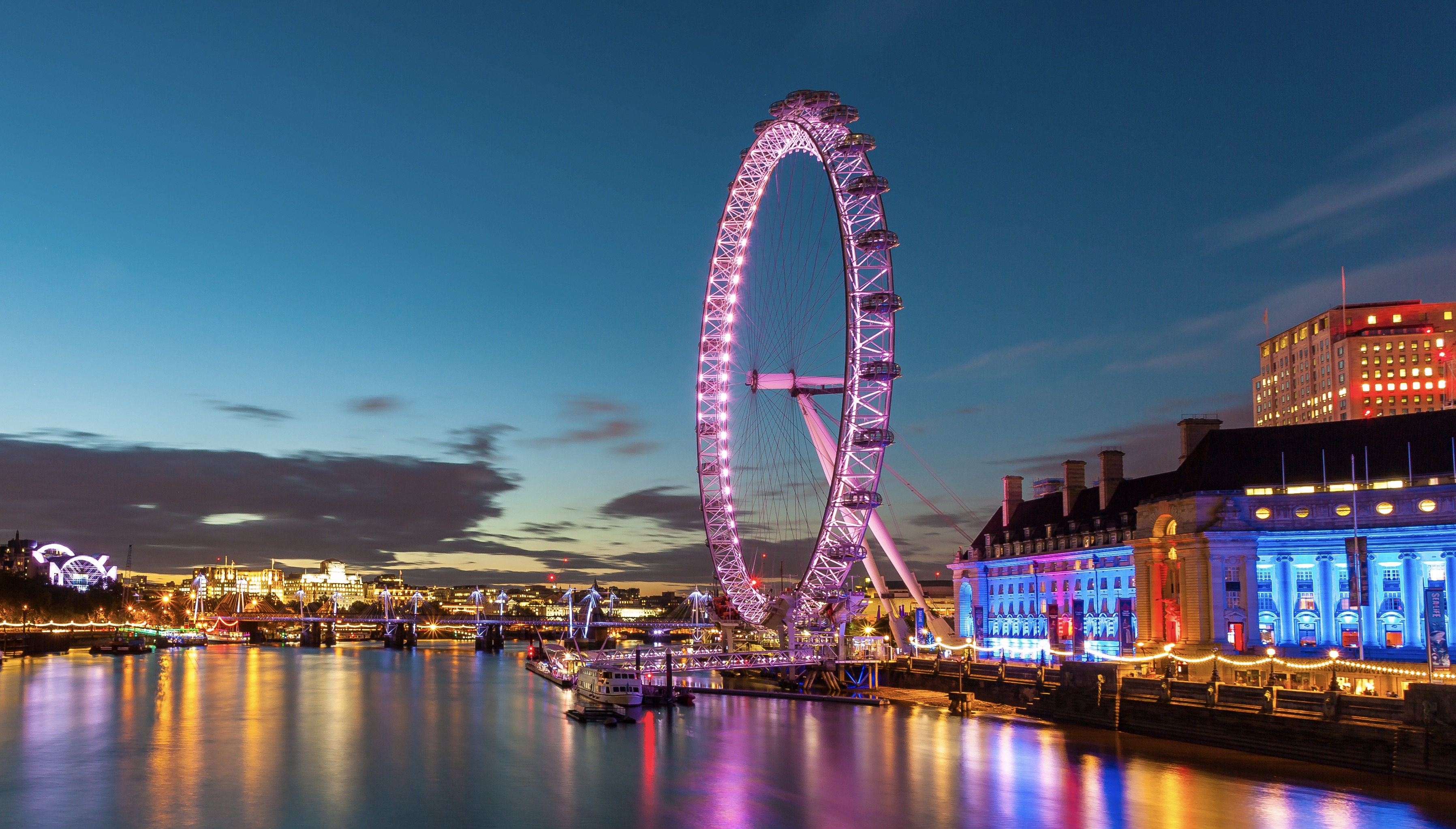 London Eye at night with reflections