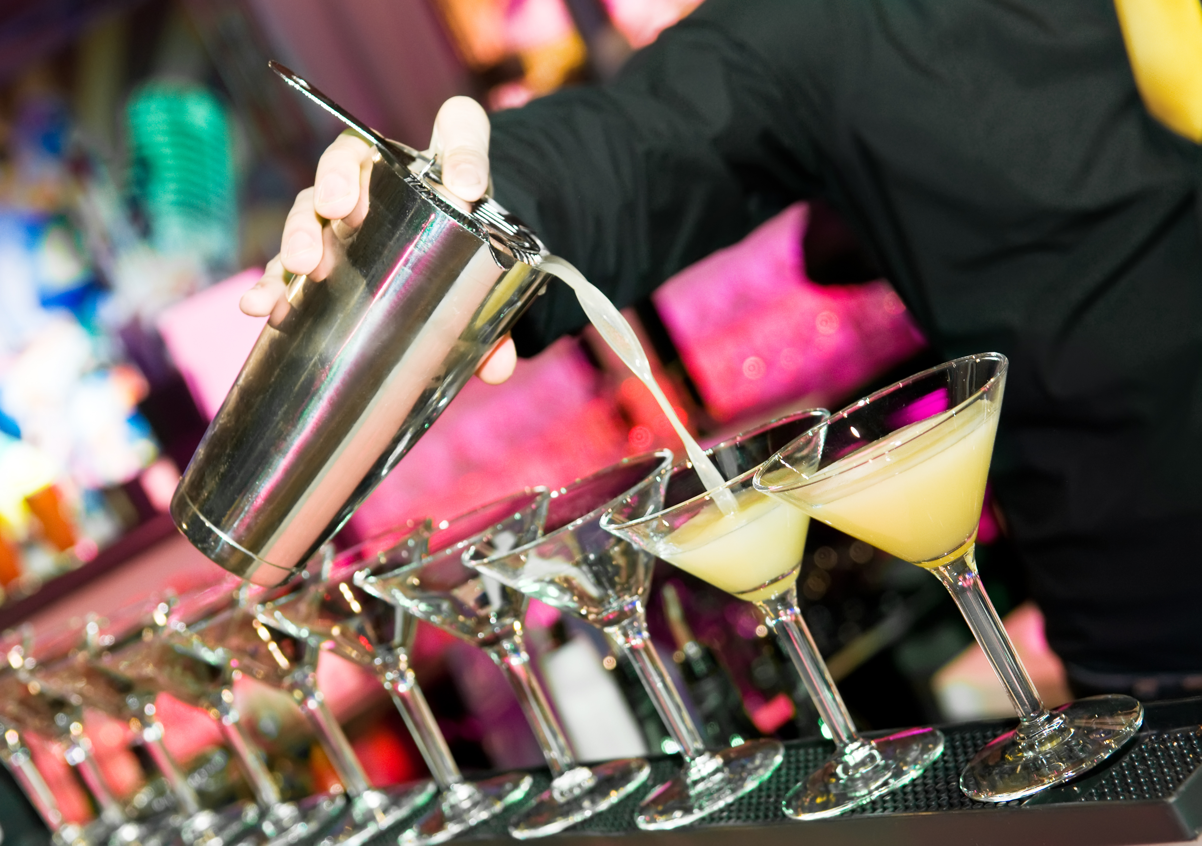 Bartender pouring cocktails