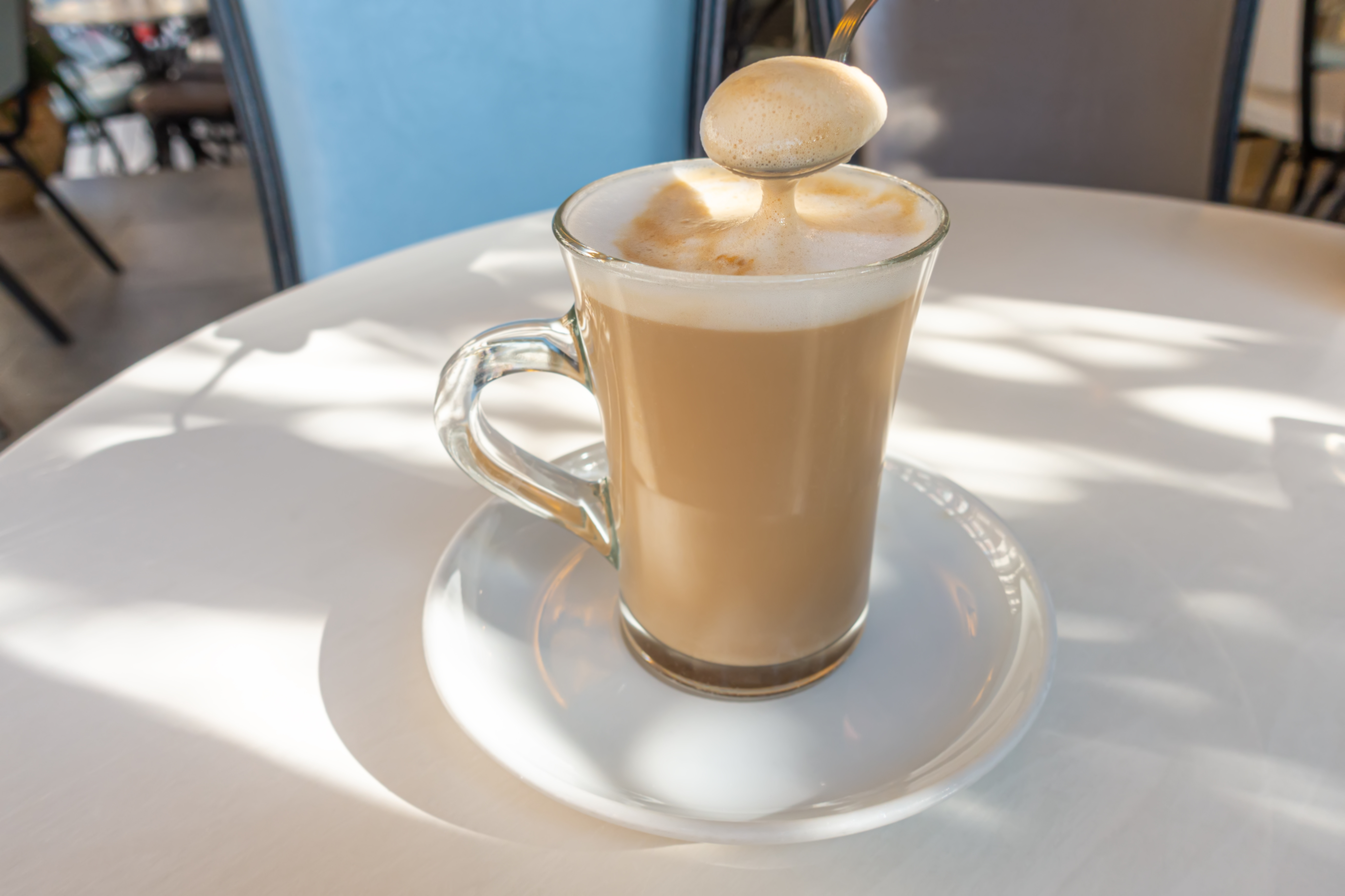 A spoon of coffee at outdoor cafe