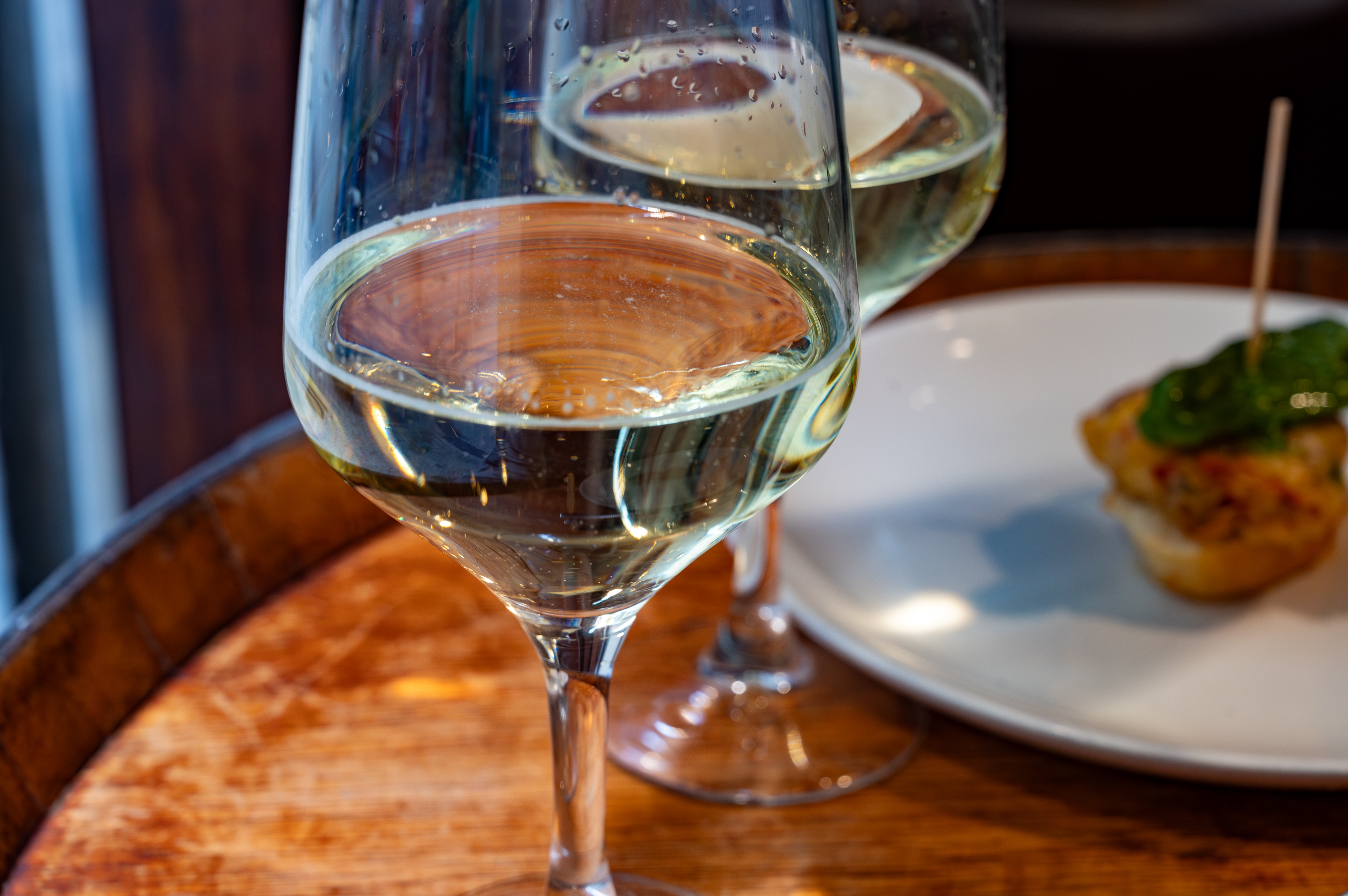 Glasses of txakoli or chacolí slightly sparkling very dry white wine, produced in Spanish Basque Country in typical pinchos bar