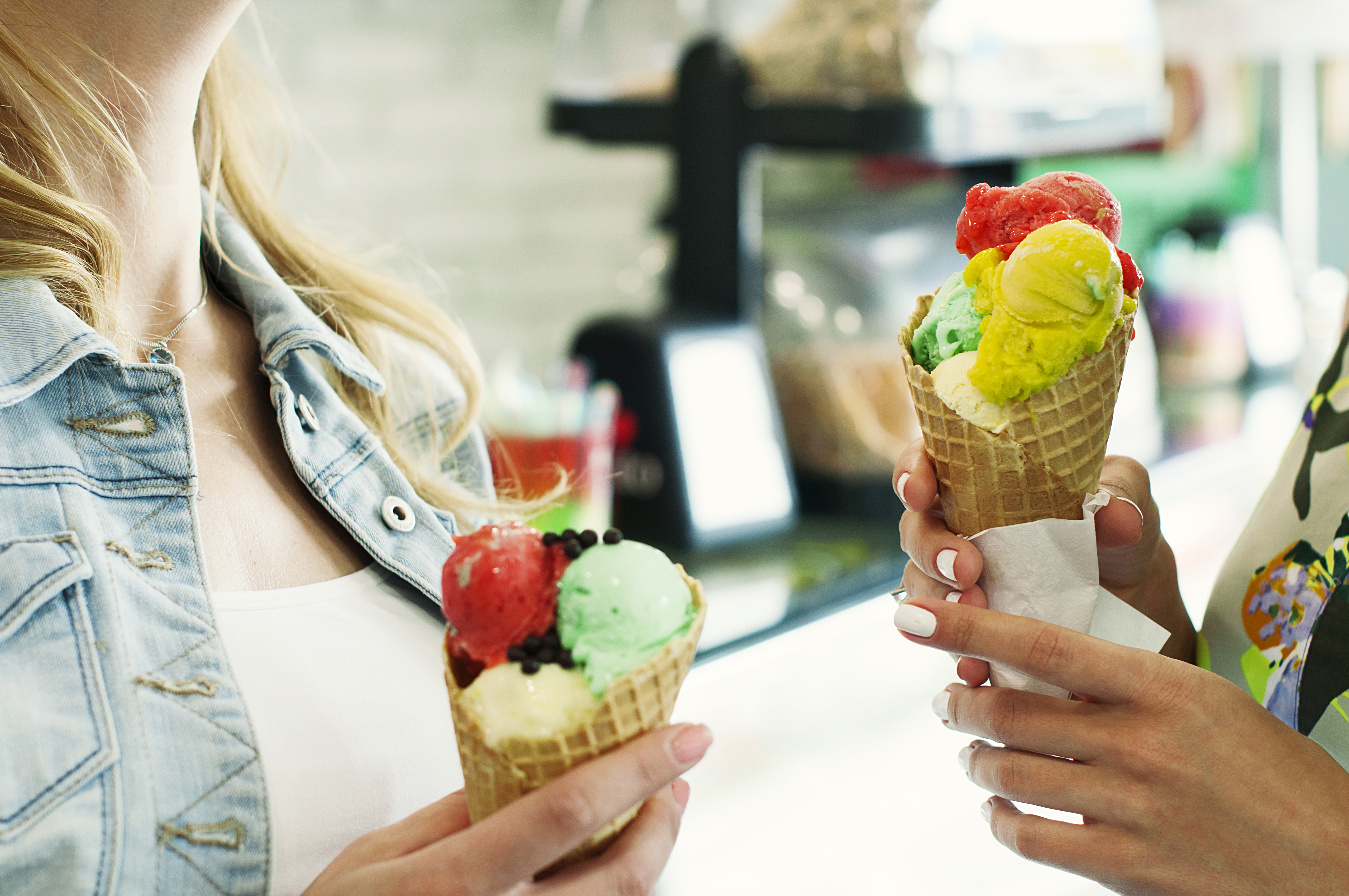 Beautiful girl eating an italian ice cream, selective focus