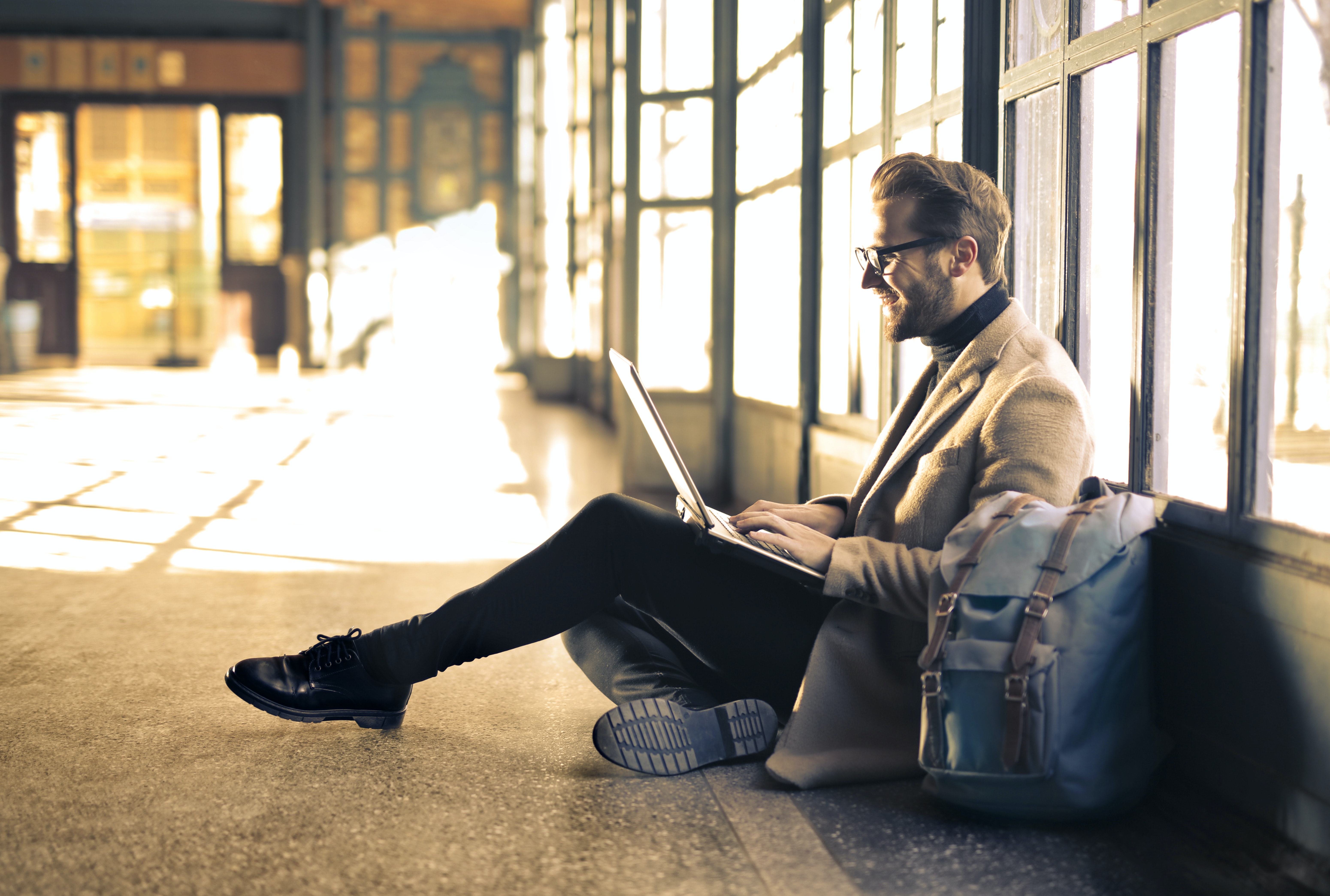 man on the floor of an airport