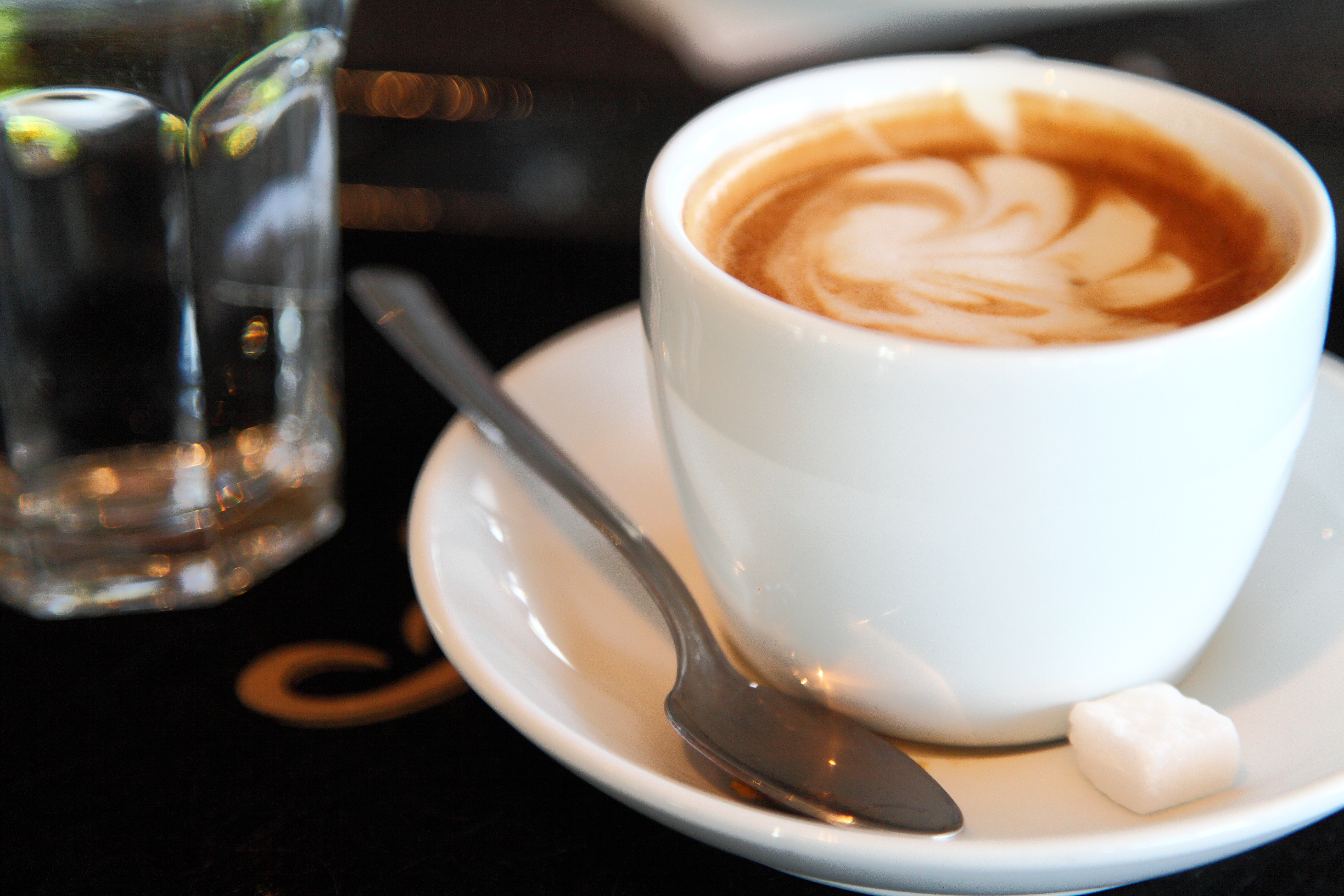 Cup of freshly brewed cappuccino in a cafe