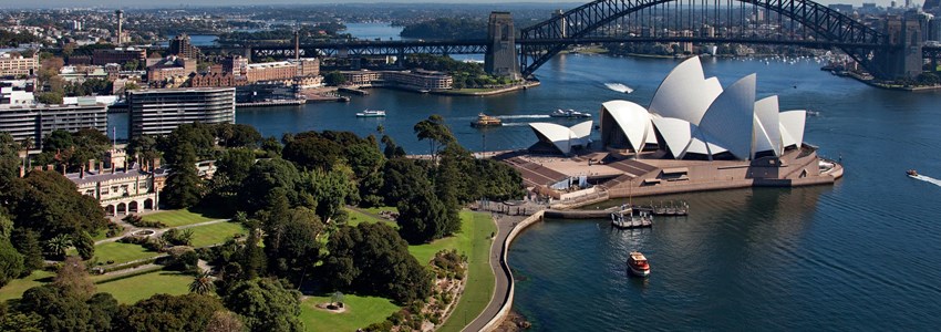 Aerial view of Sydney Harbour featuring the Royal Botanic Gardens, Sydney Opera House and Sydney Harbour Bridge