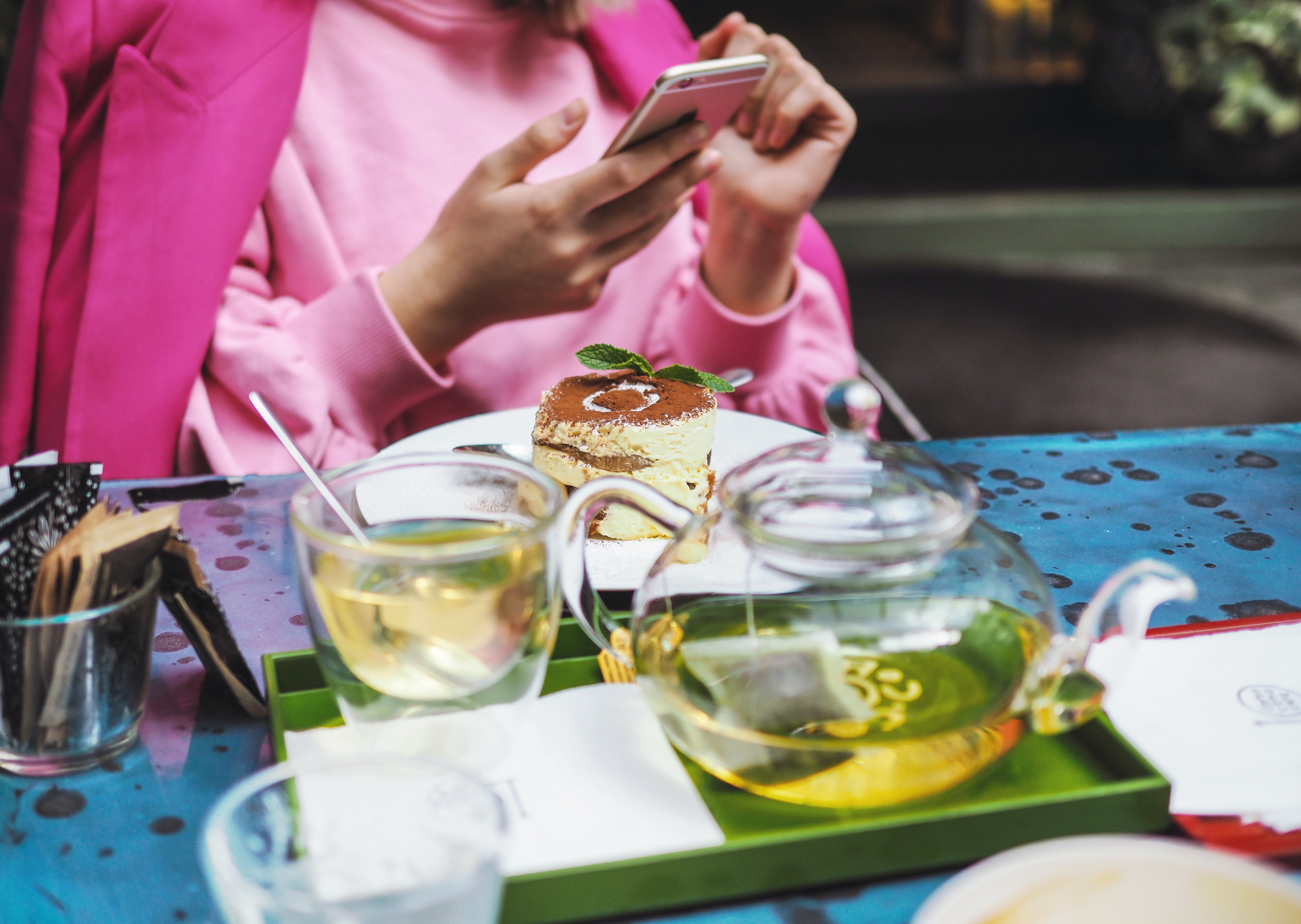 woman at a cafe with tea and tiramisu, 10 Corso Como, Milan, Italy
