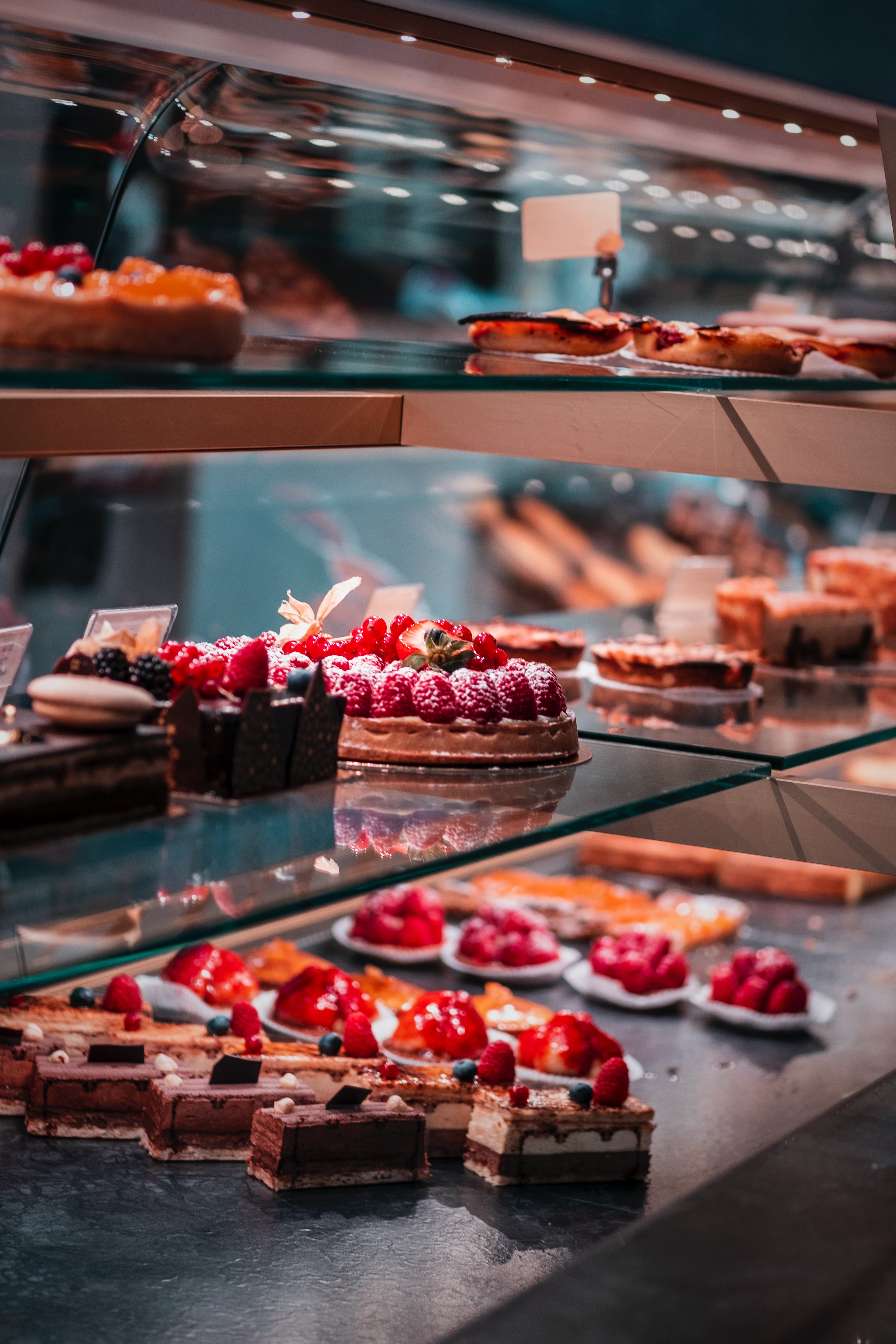 fruit and berry cakes and tarts in a vitrine, Pasticceria Castelnuovo, Milan, Italy