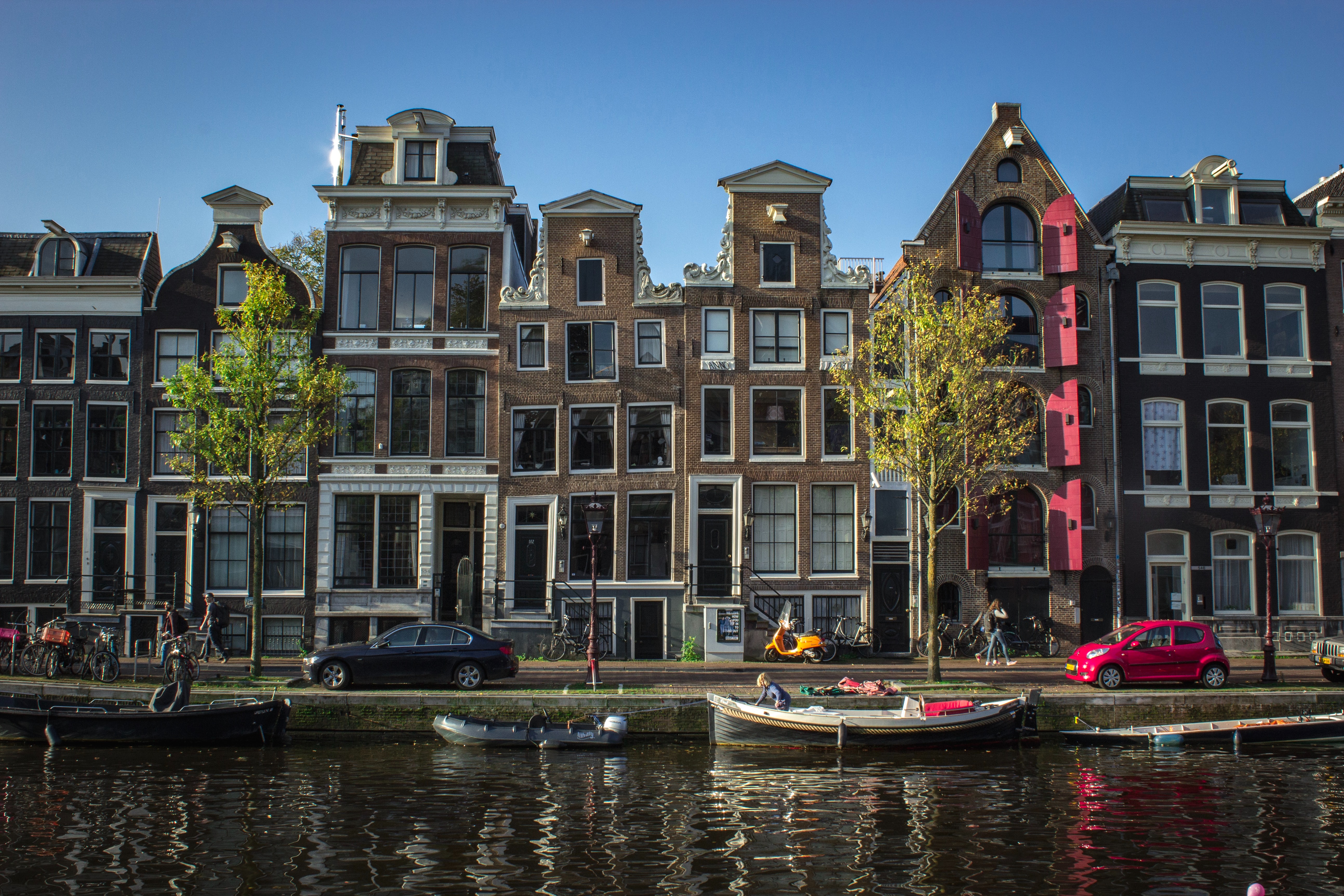 typical houses by a canal in the Jordaan neighbourhood in Amsterdam, the Netherlands