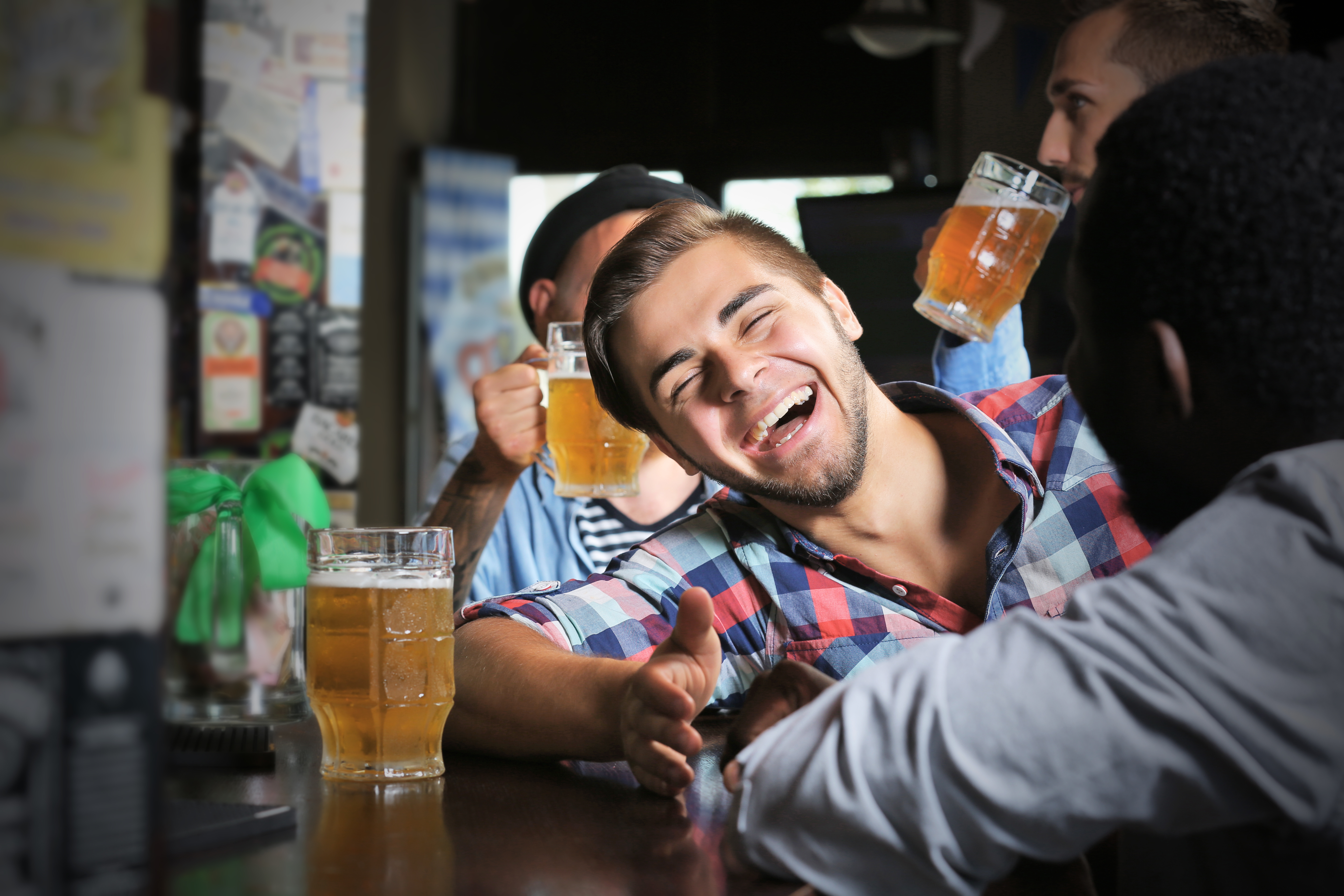 laughing people drinking beer