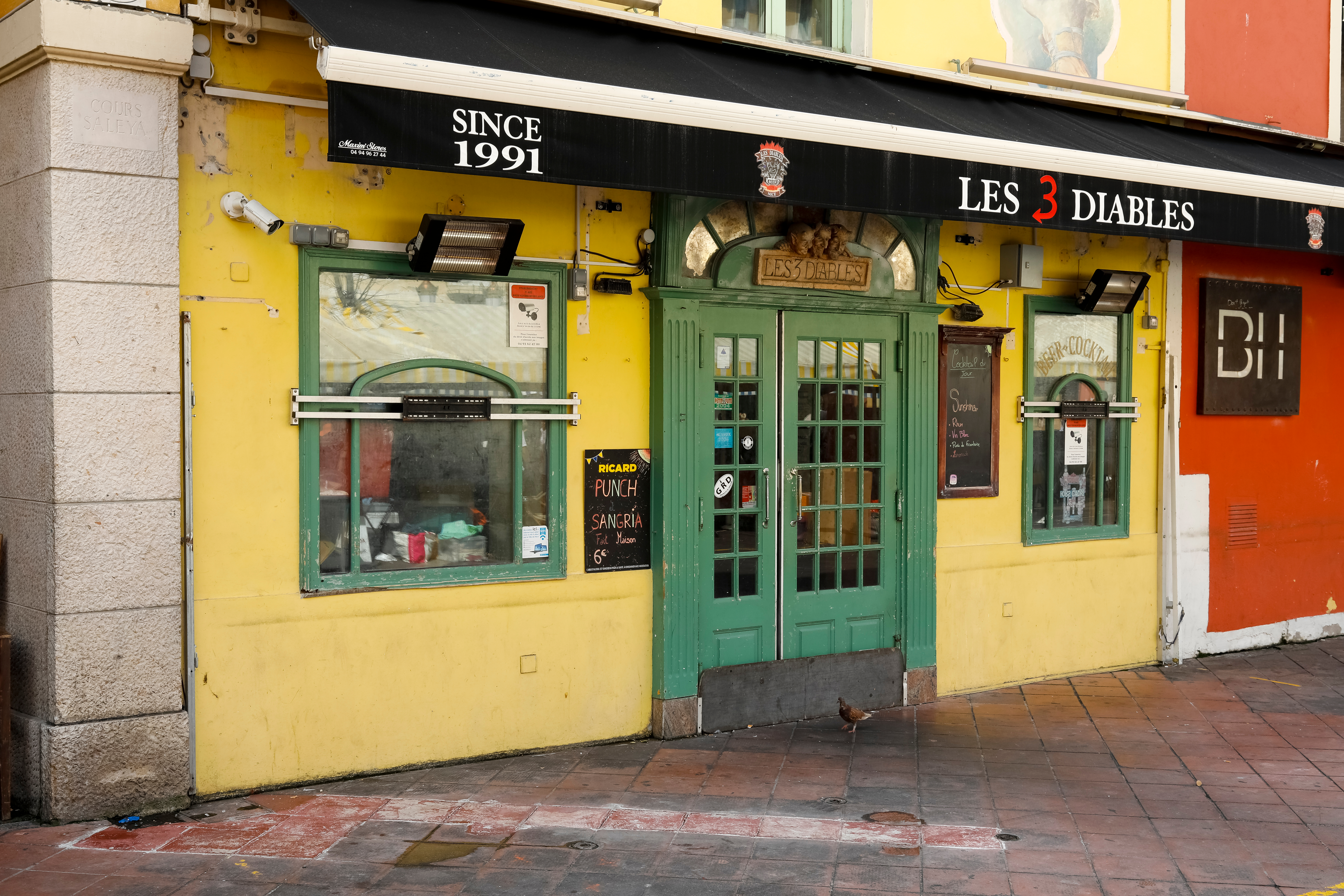 Green door to The Three Devils Restaurant (Les Trois Diables), which is located at Cours Saleya