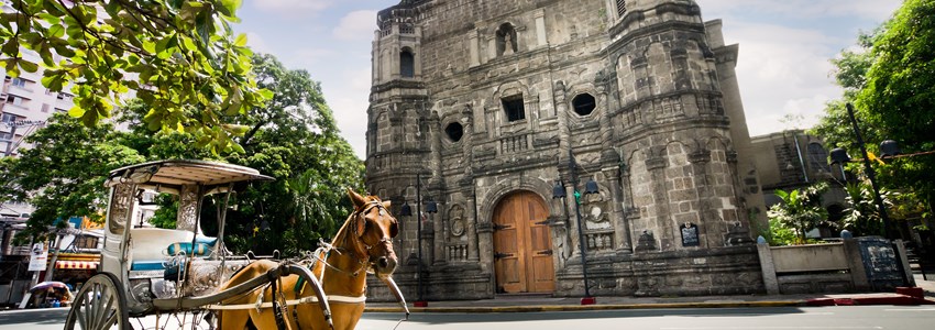 Horse Drawn Carriage parking in front of Malate church , Manila Philippines