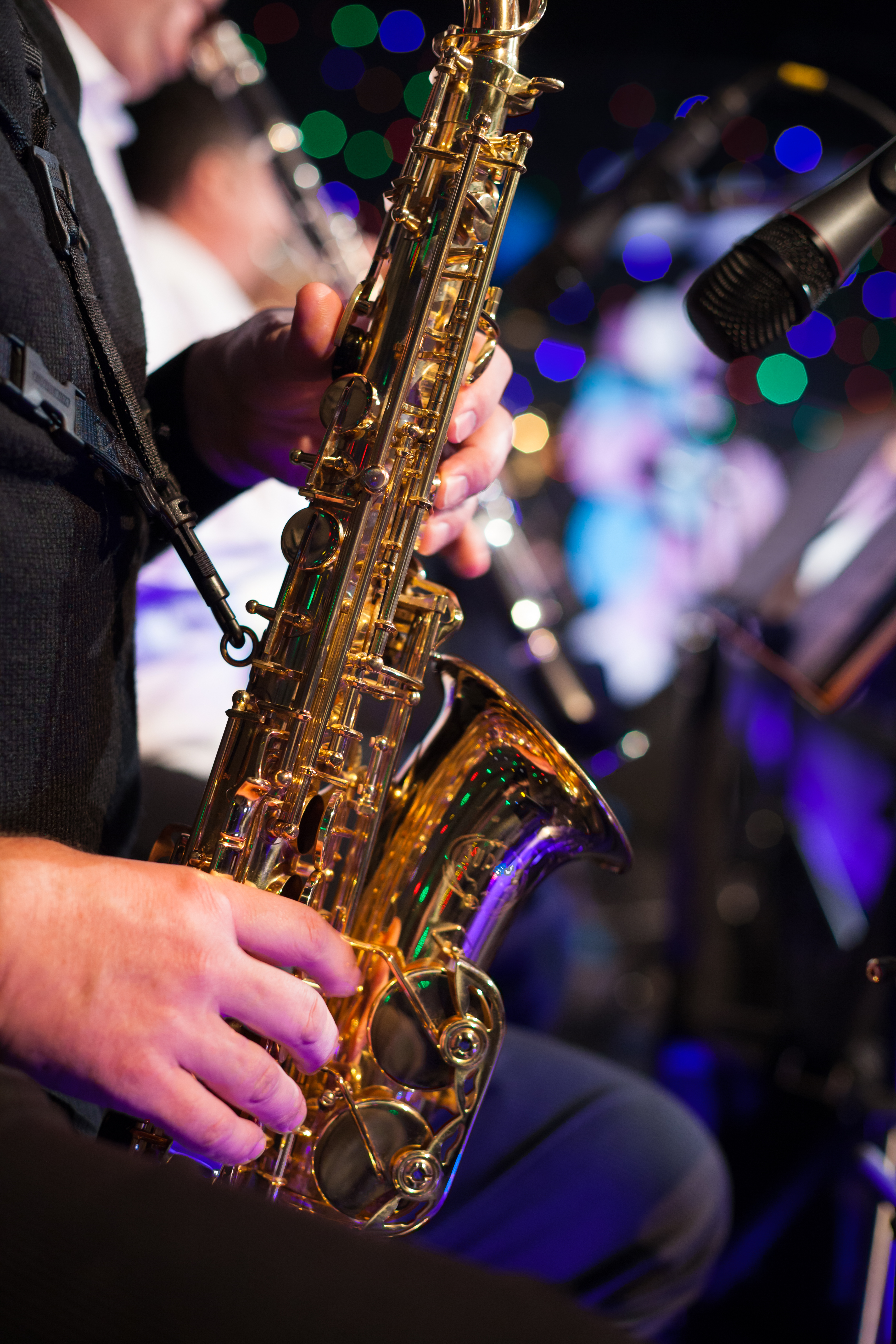 Photo of the male jazz saxophonist playing in sax