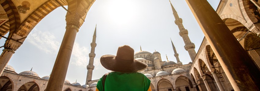 Young woman traveler looking on amazing Blue Mosque in Istanbul, Turkey